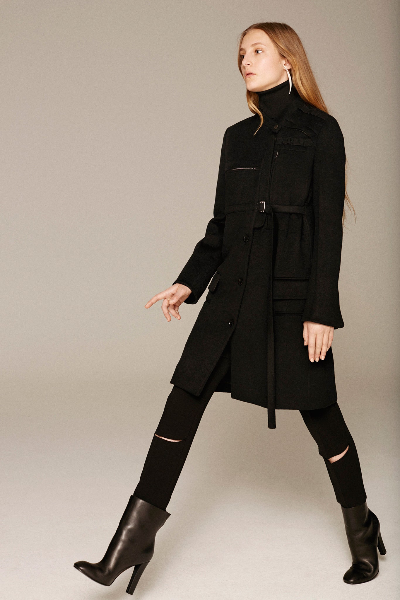 black fitted coat with cutout pants