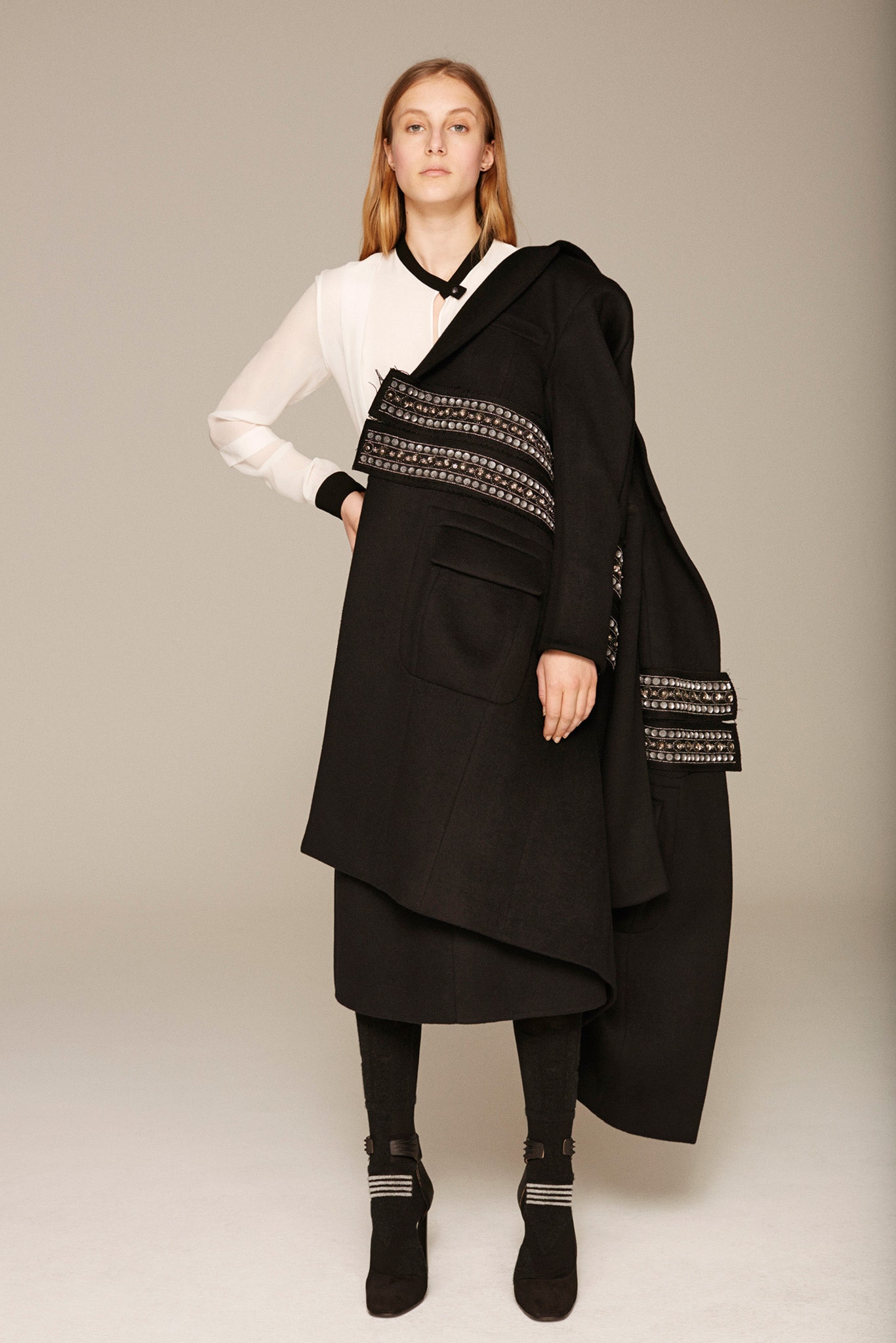 black wool long-sleeve collared relaxed layered pockets coat