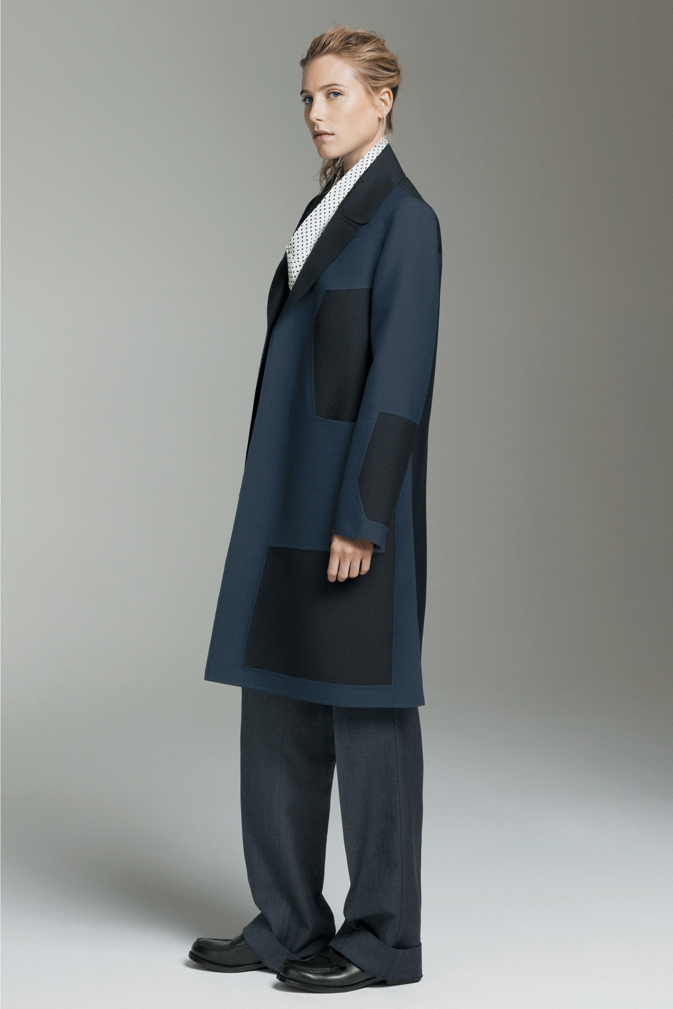 blue color-blocked coat and gray tailored pants