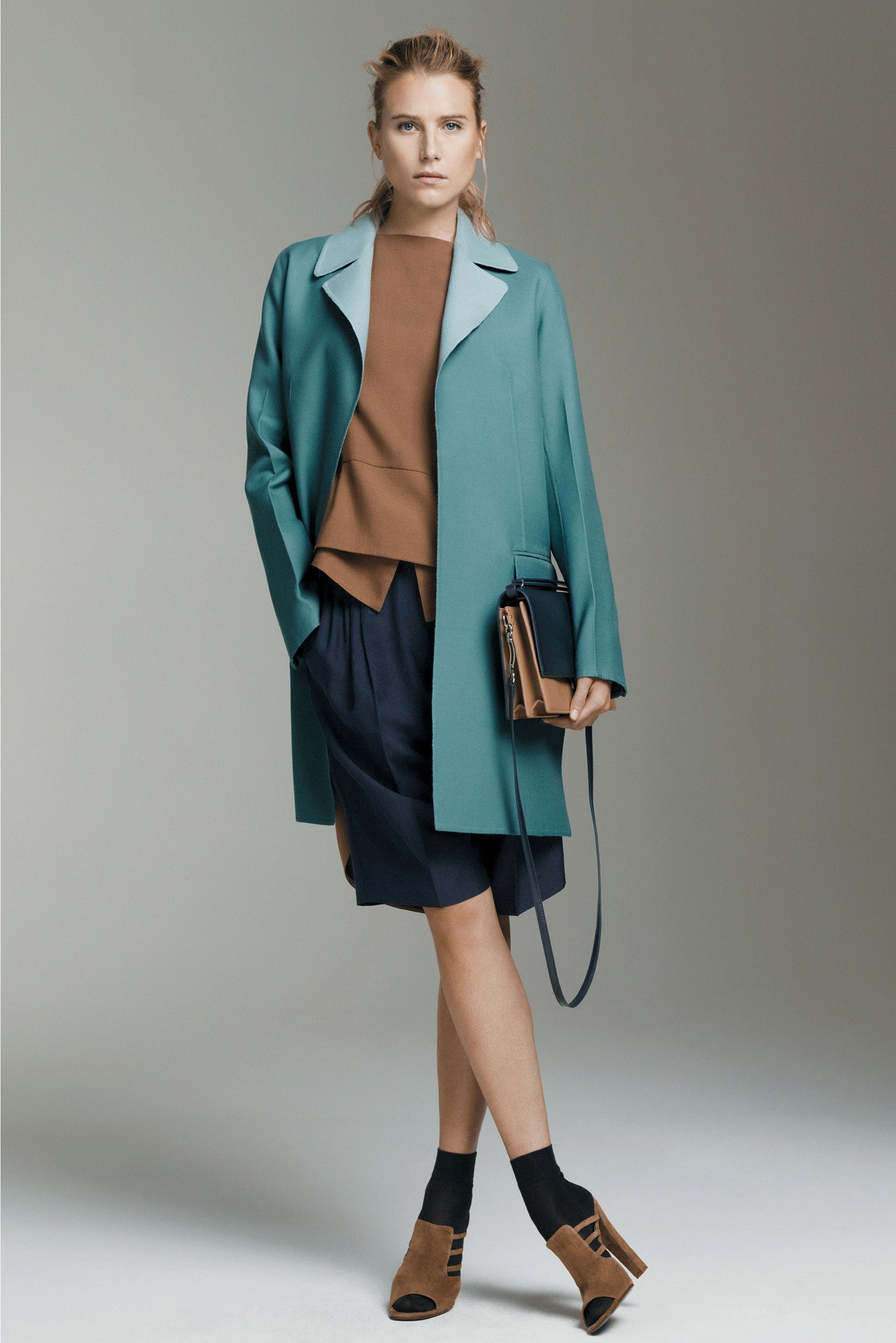 teal coat brown top navy skirt