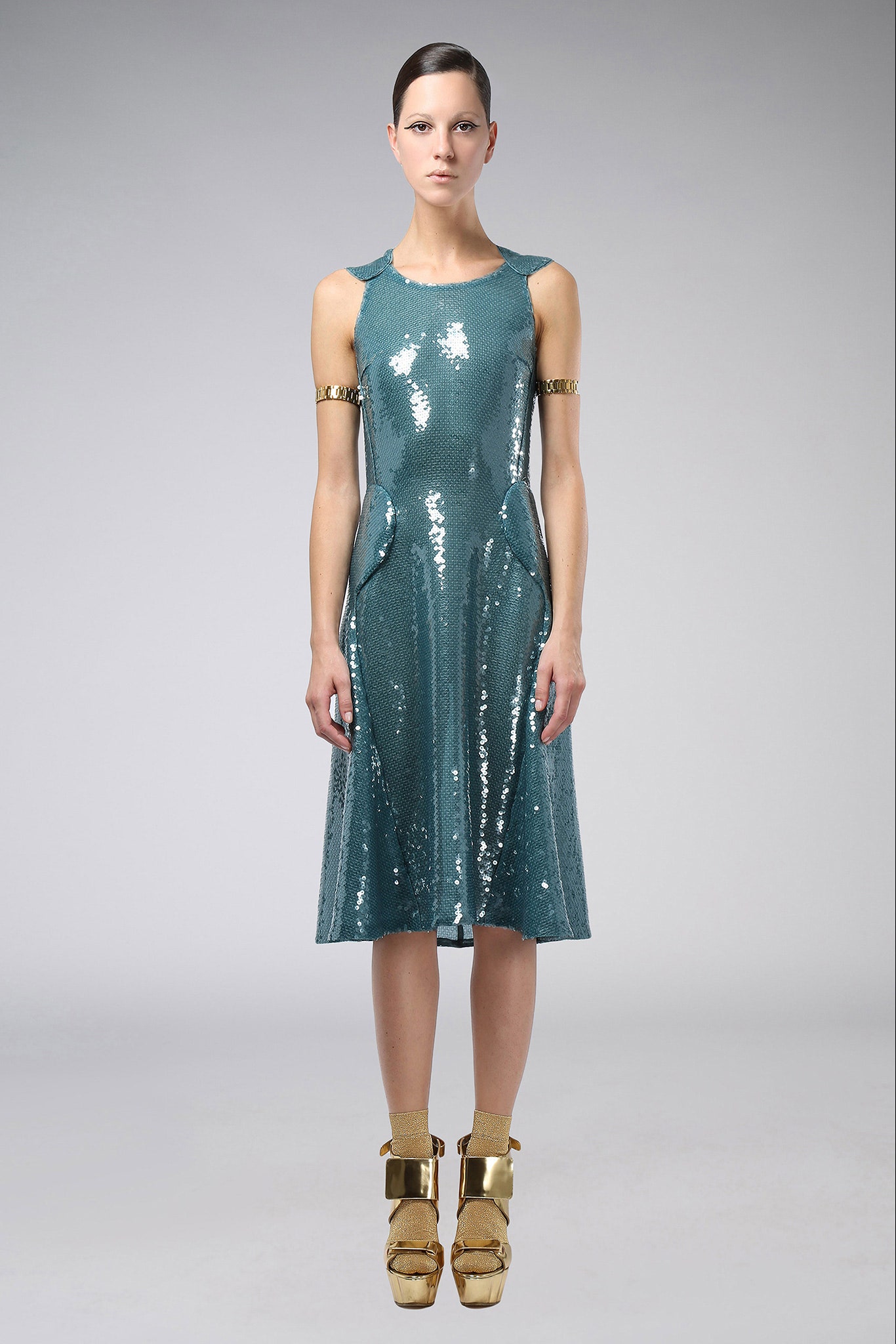 blue sequin midi dress with gold shoes