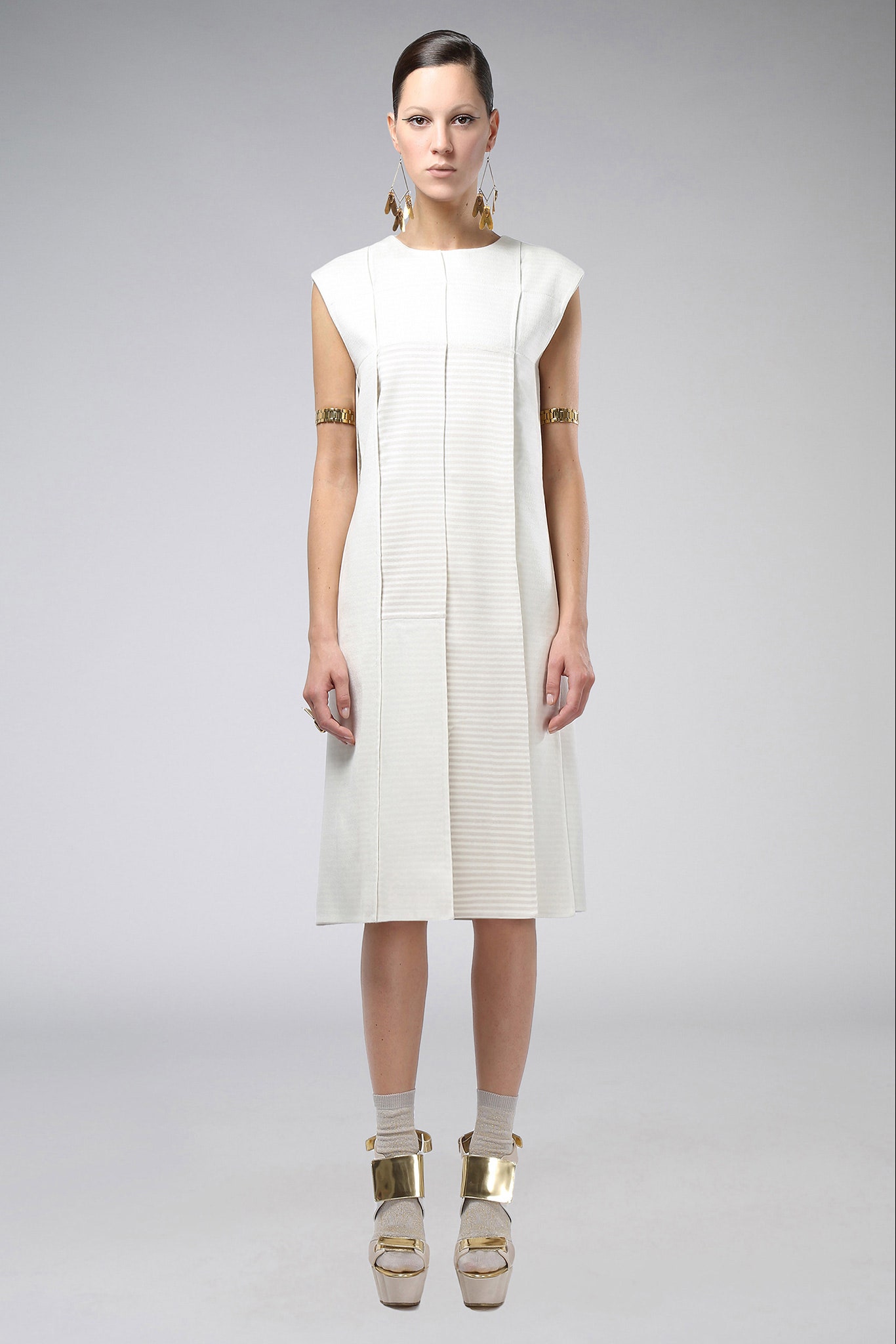 white pleated midi dress with gold shoes