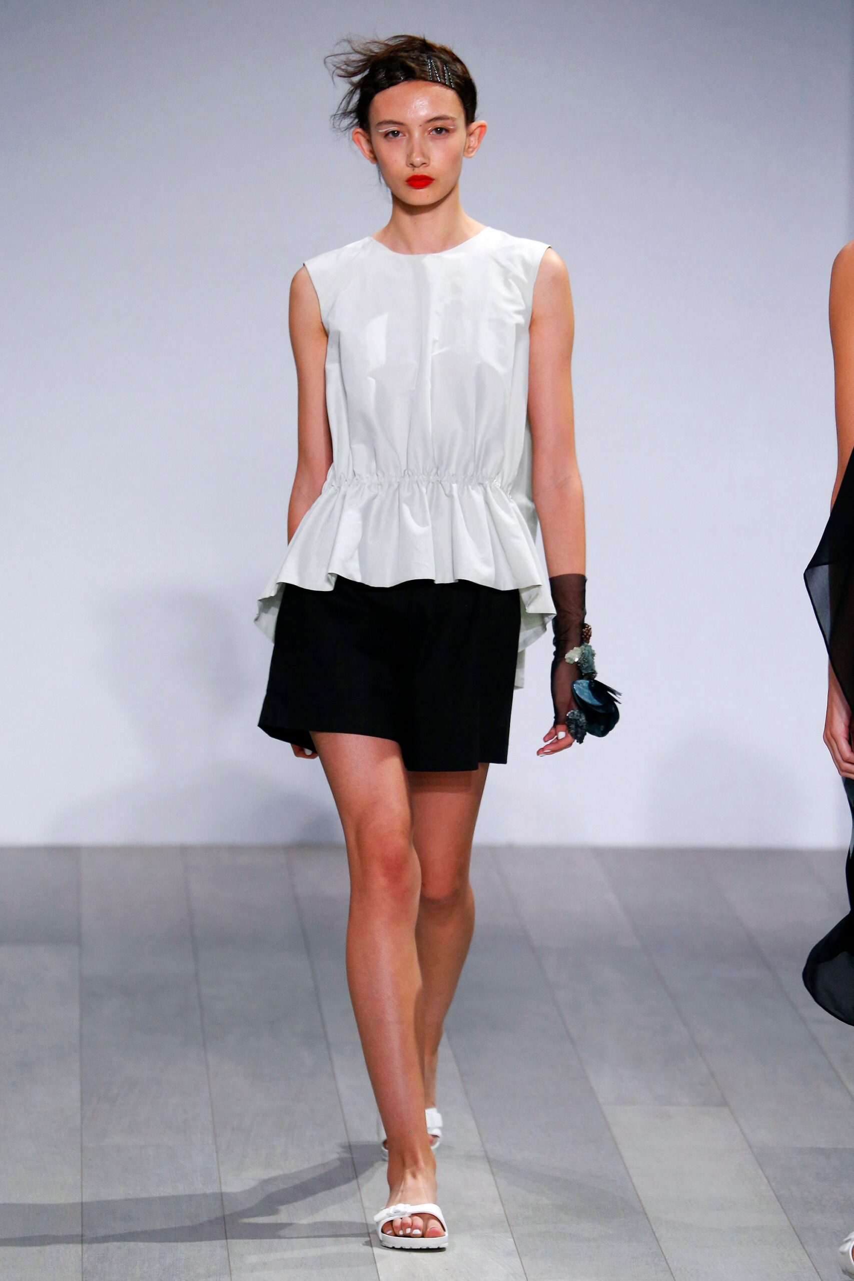 white fitted top with black shorts