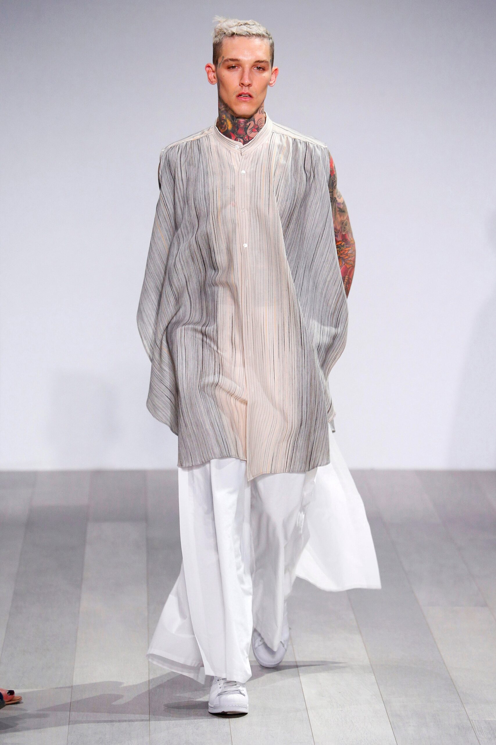 flowing white pleated top with relaxed pants