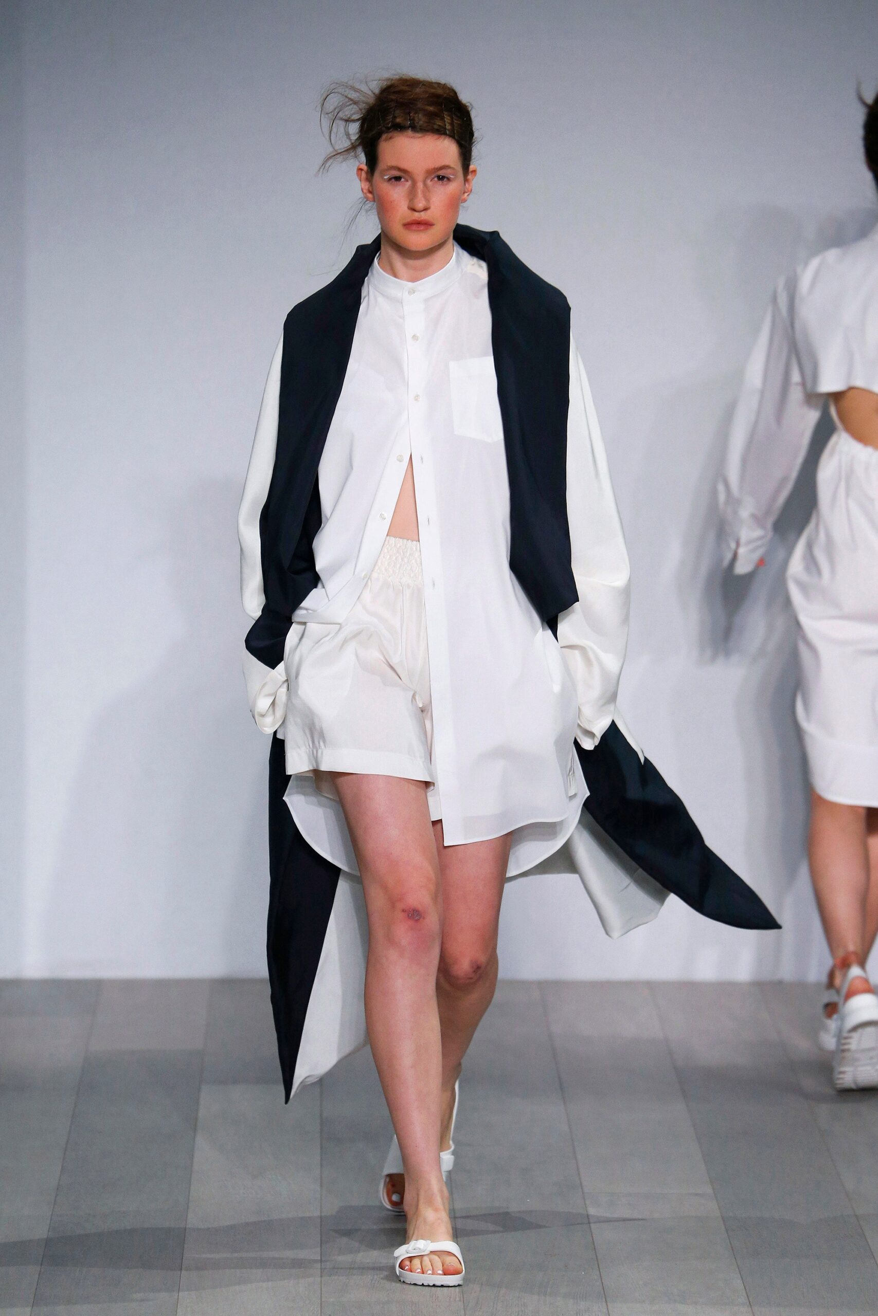 white relaxed shirt with black cape