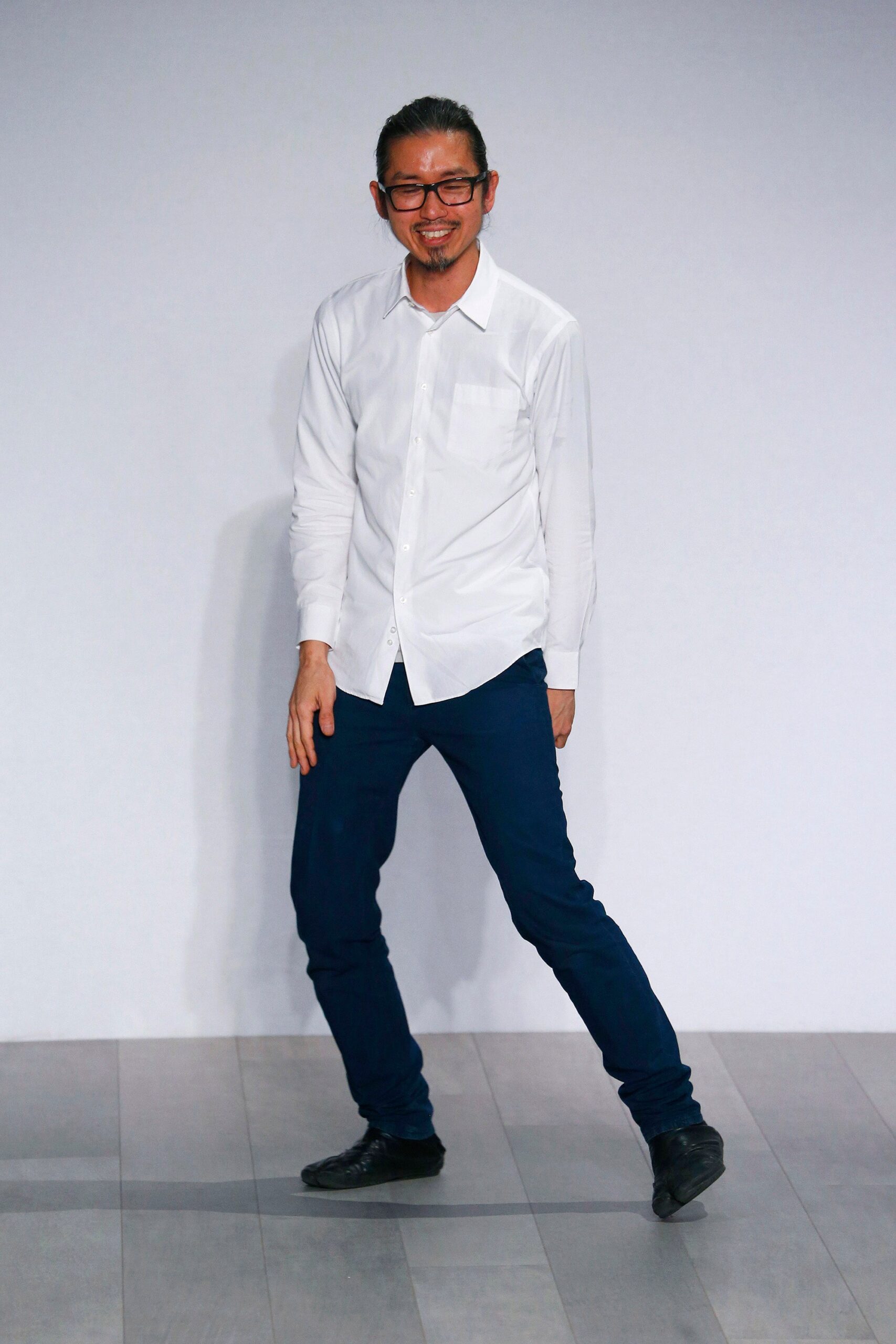 white fitted shirt and blue pants