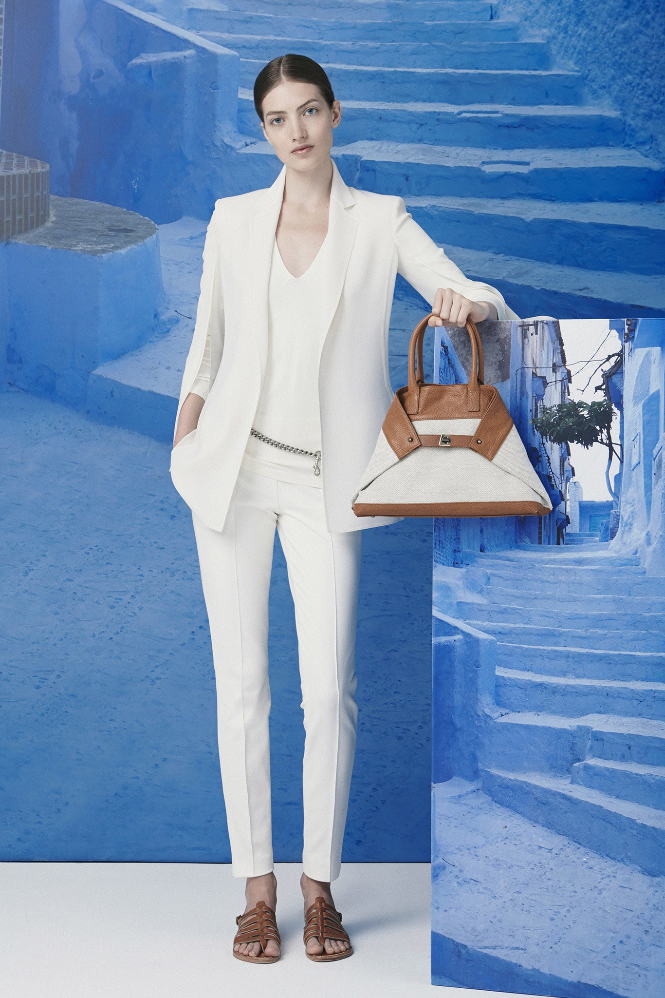 white tailored suit with brown accessories