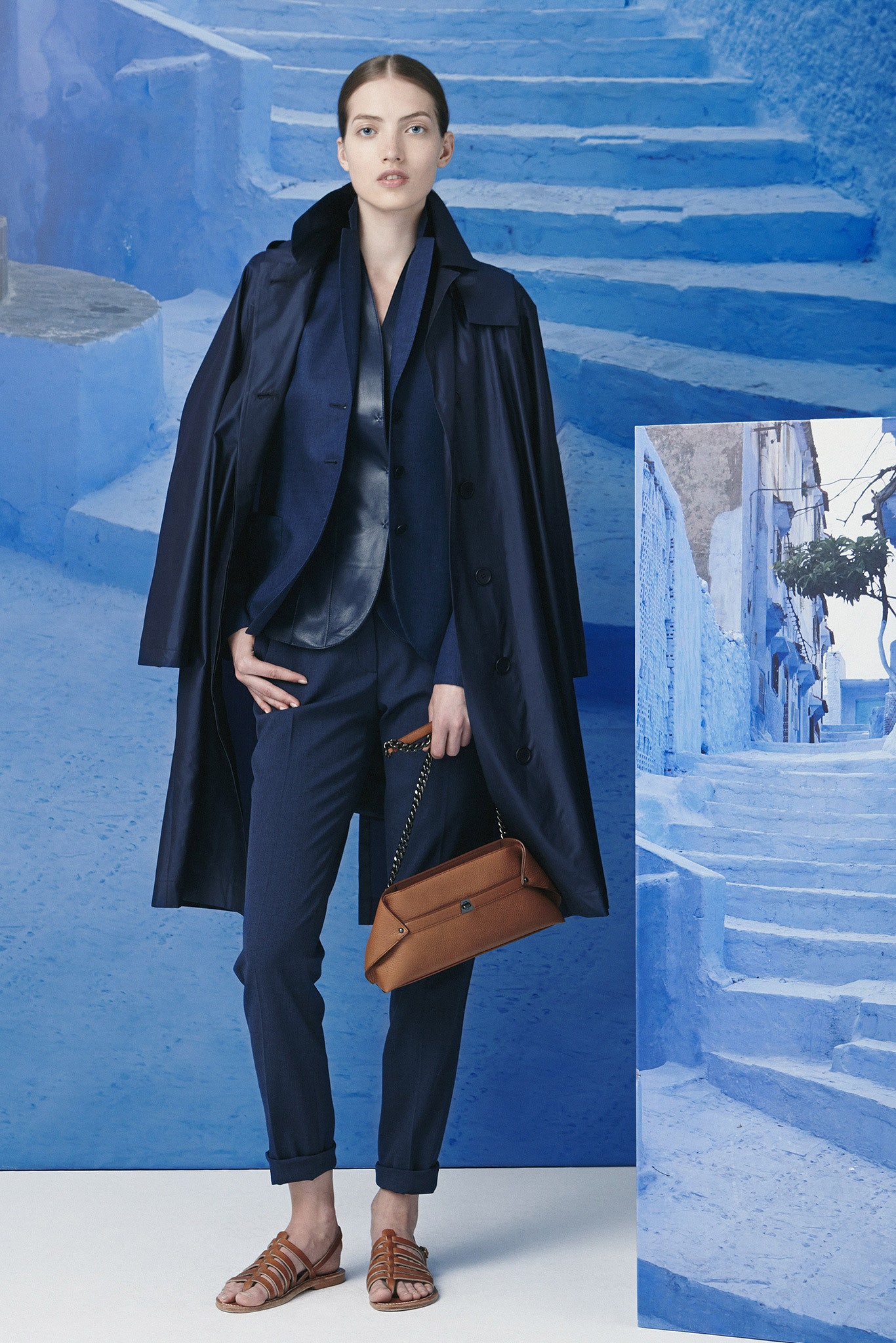 navy trench coat and tailored suit