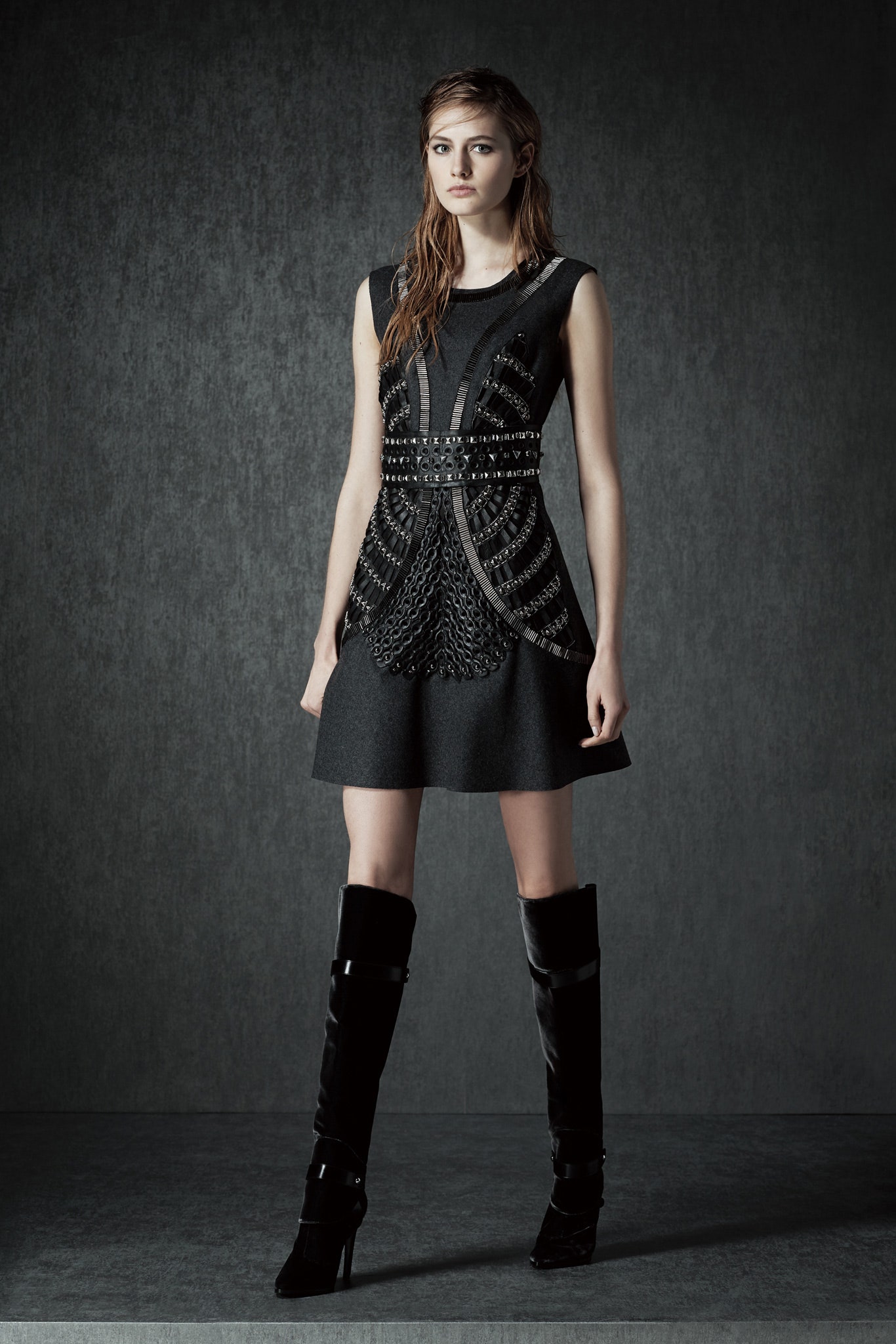 black fitted sleeveless dress with boots