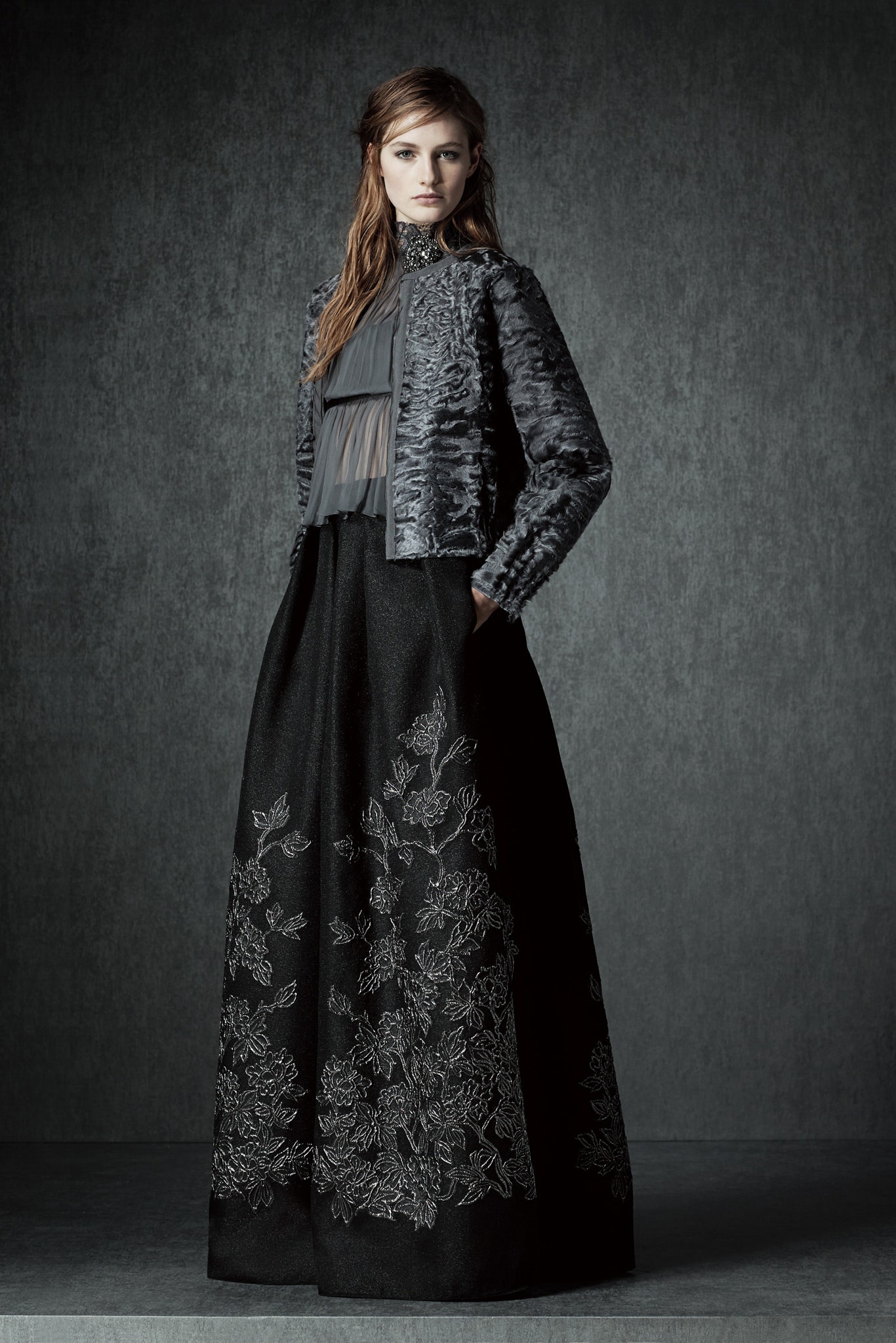 gray faux-fur jacket and black embroidered dress