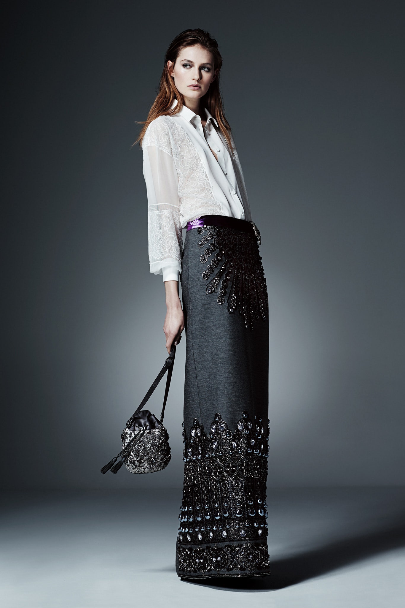 white embroidered shirt and gray beaded skirt