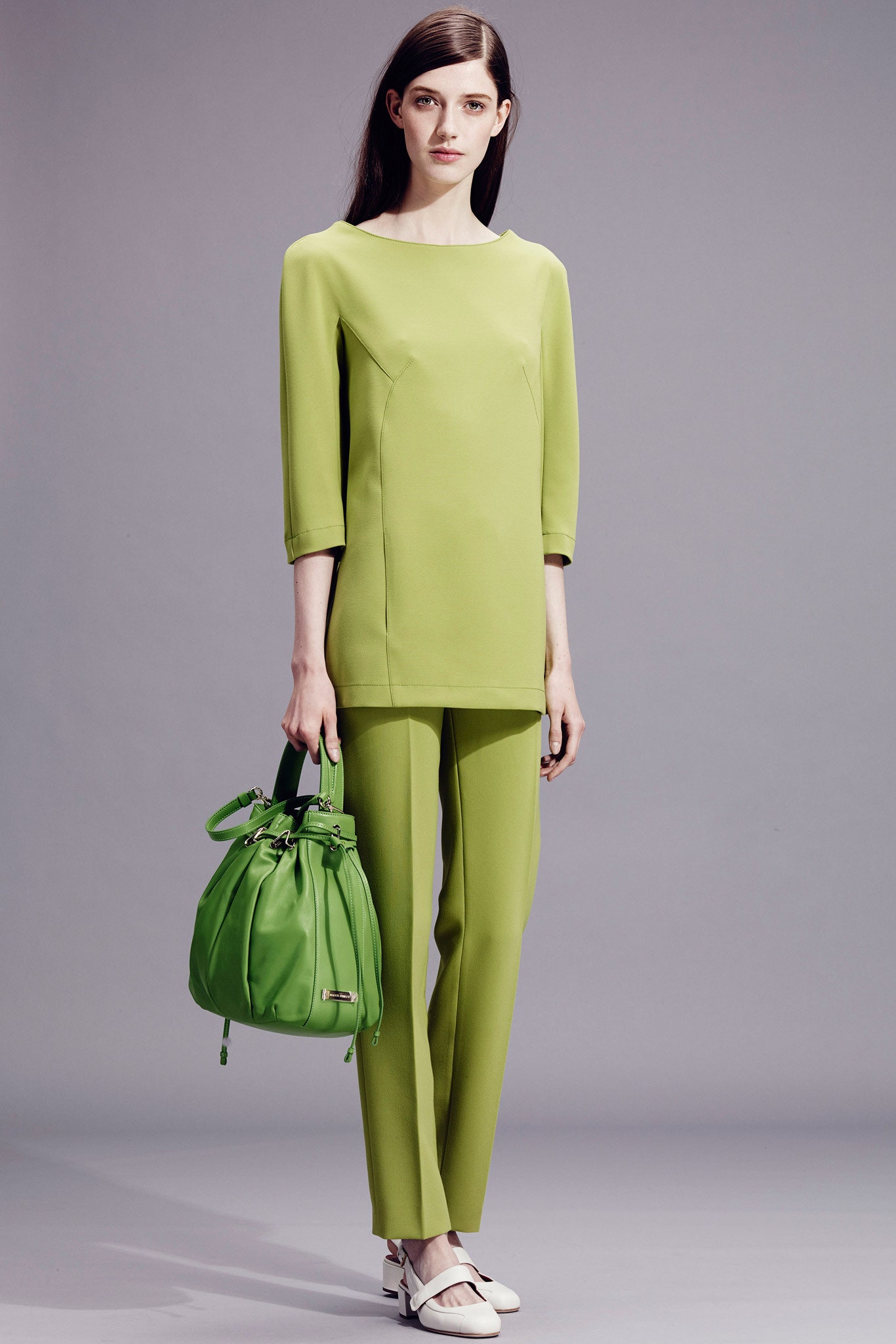 green fitted top and pants