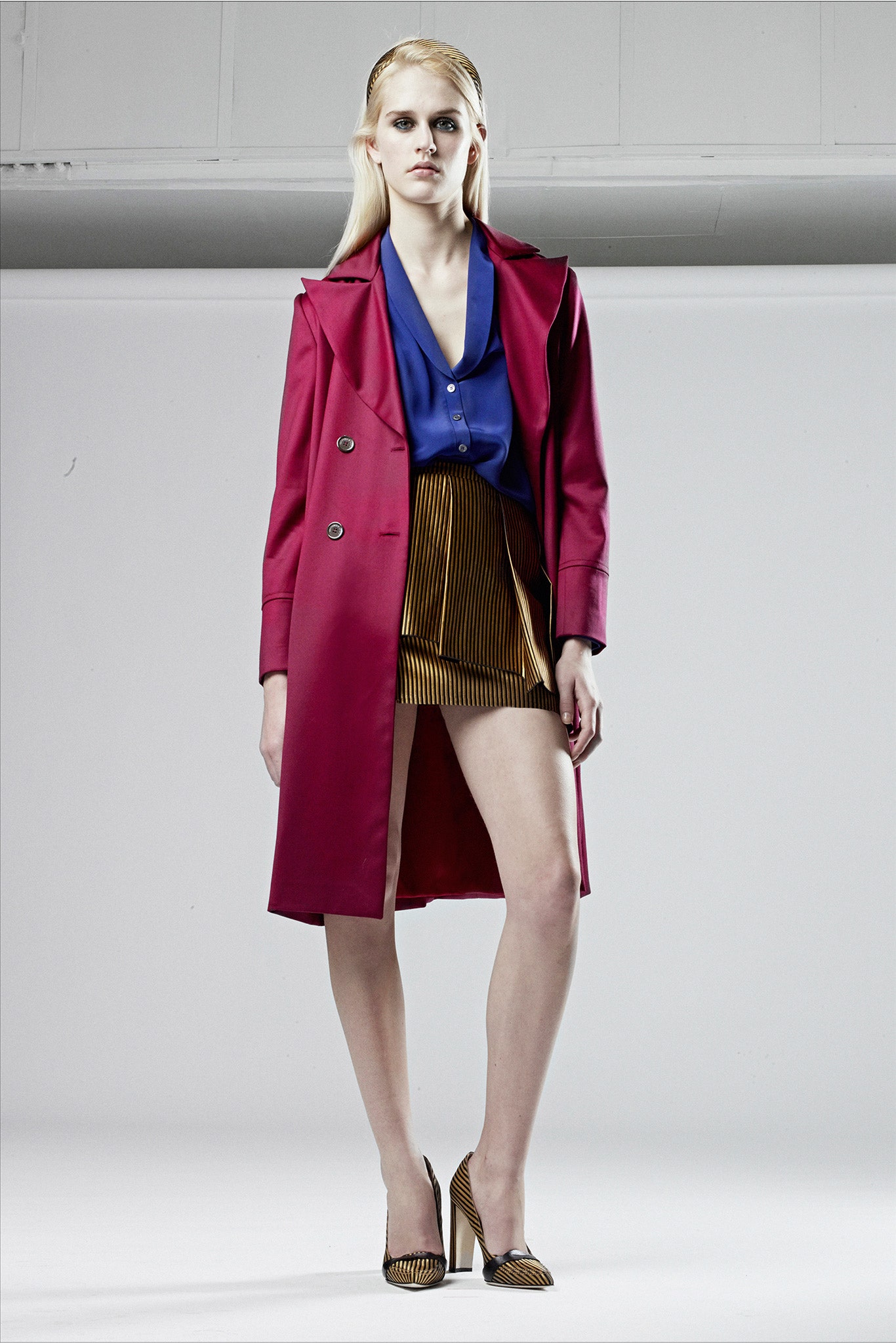 red coat blue shirt gold skirt