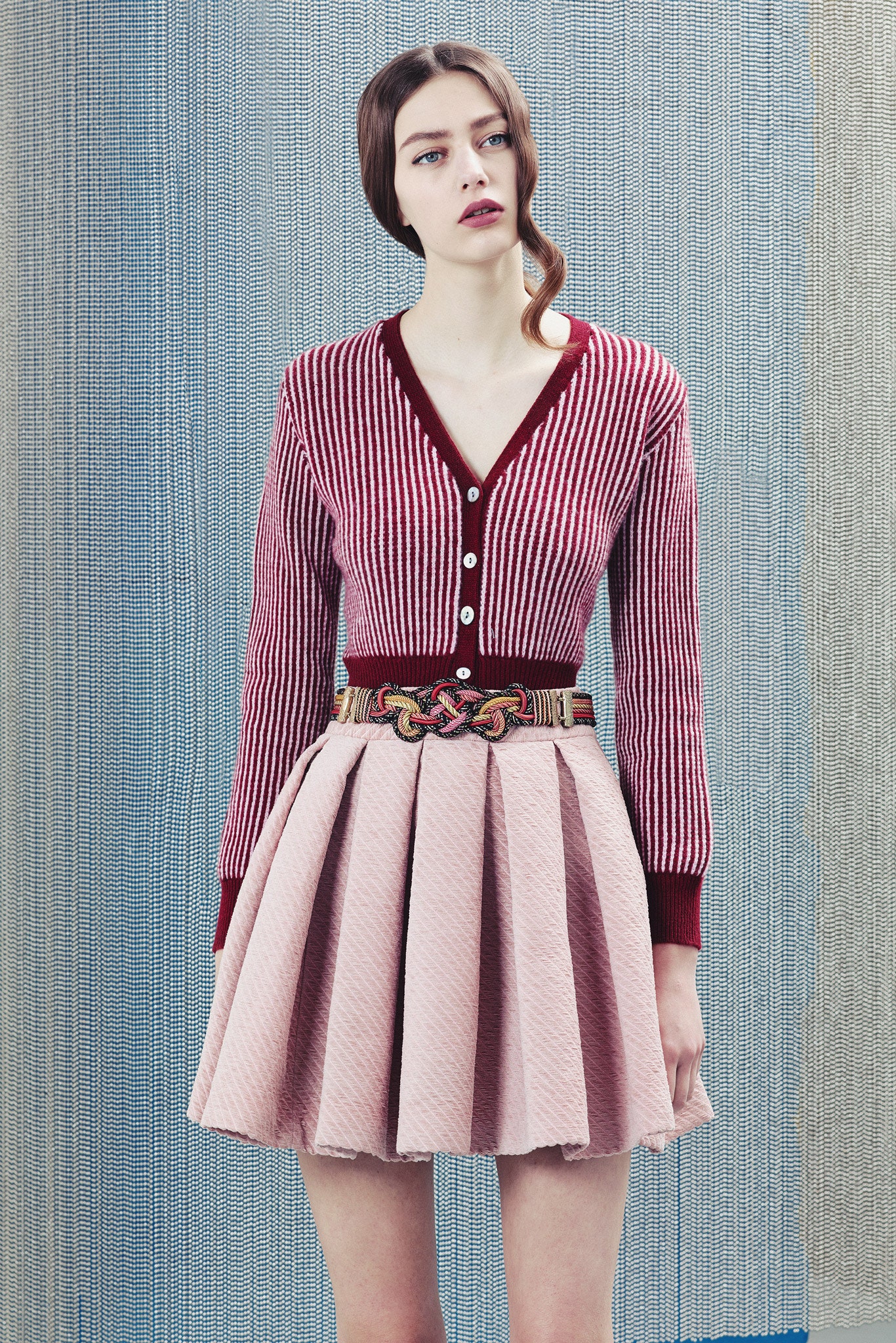 red striped cardigan with pleated pink skirt