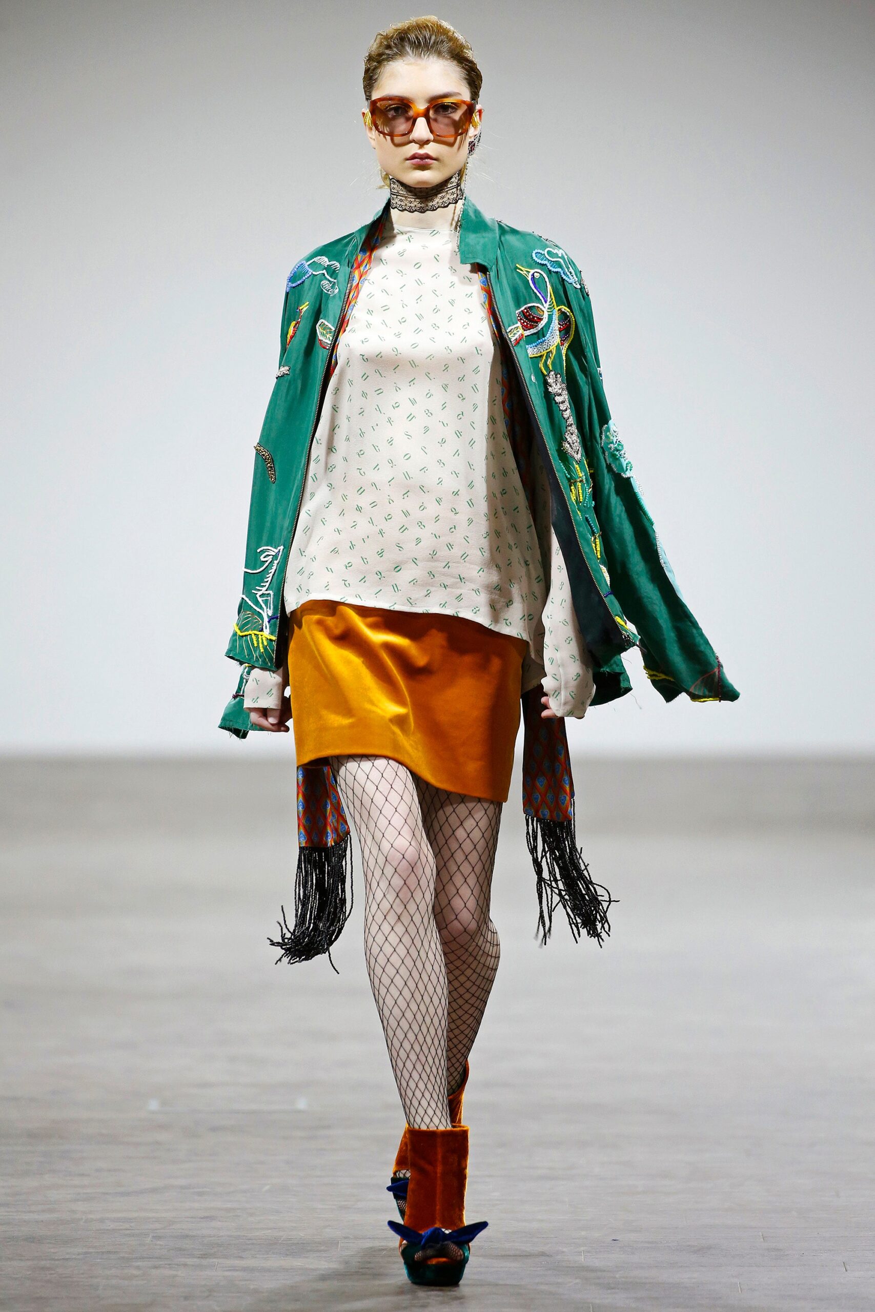 relaxed white top with orange skirt