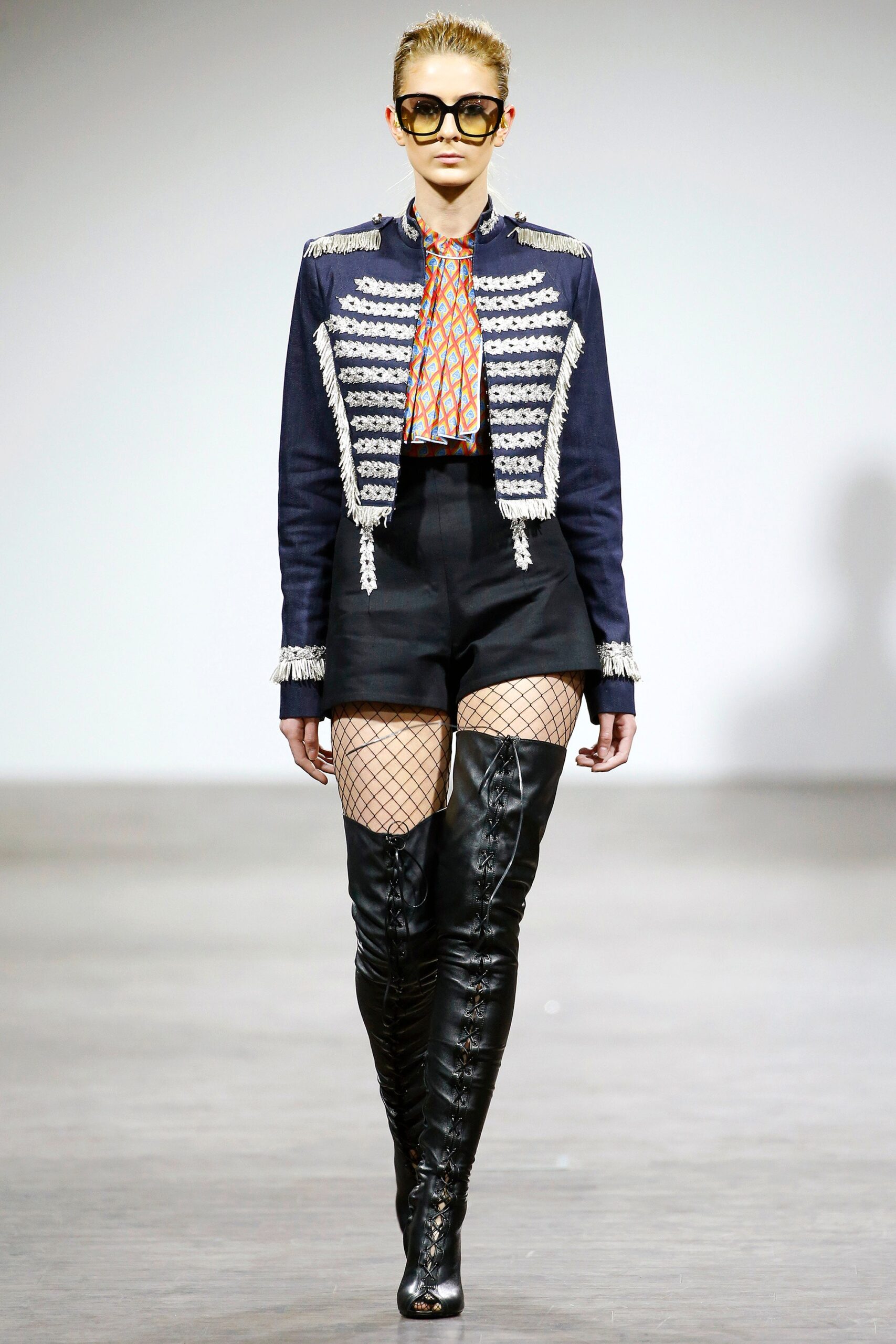 blue fitted jacket with black shorts