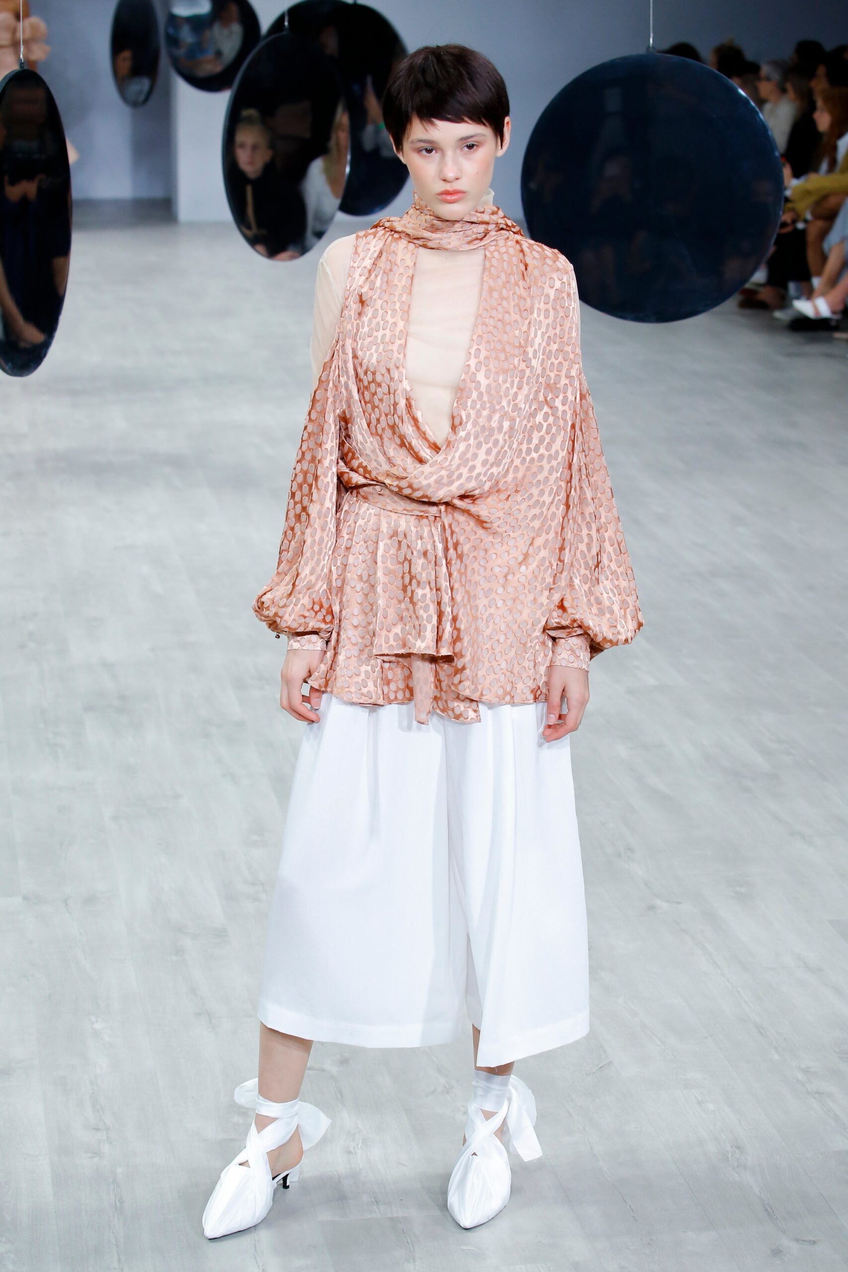 peach silk relaxed top with white wide-leg pants