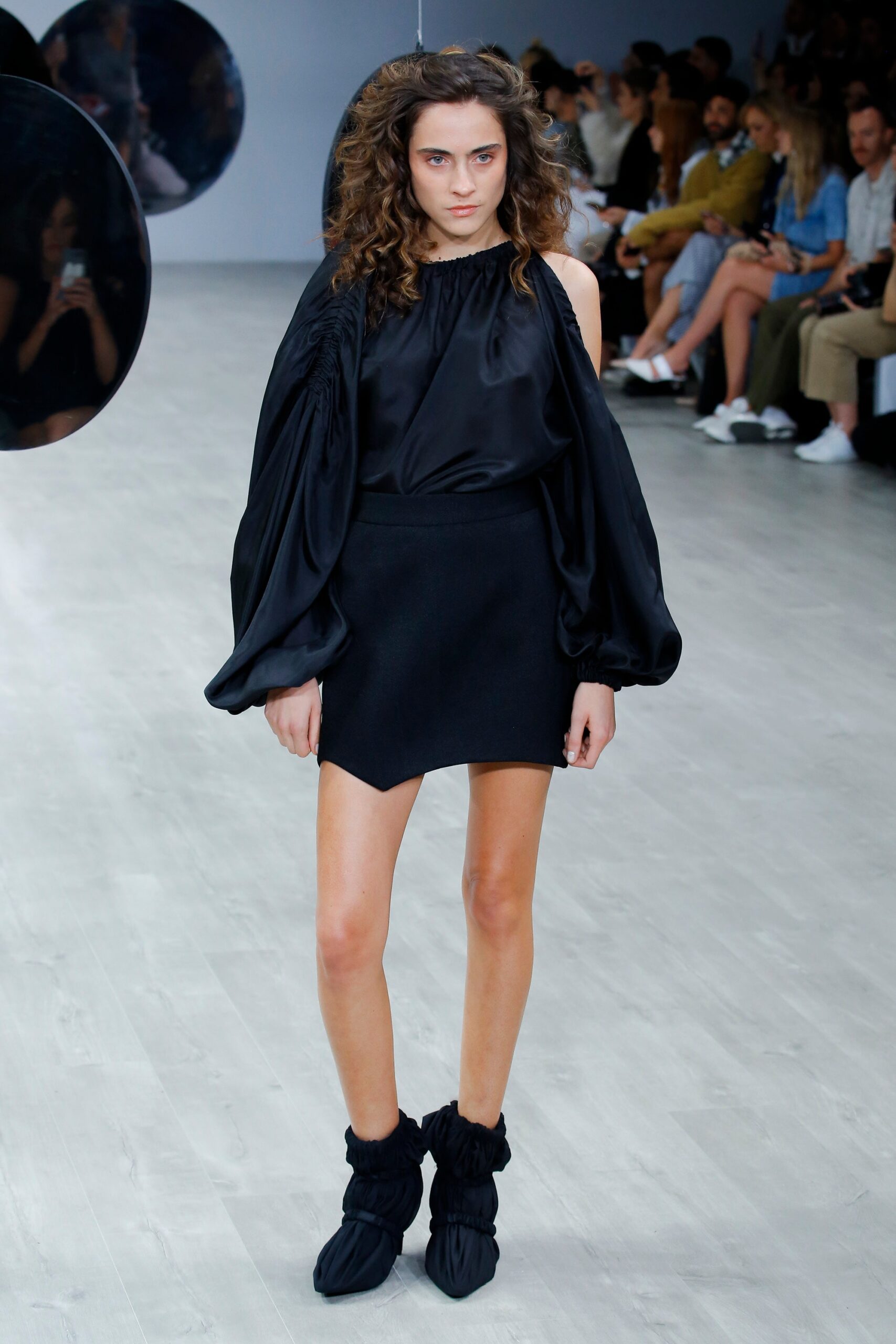 black silk off-shoulder top with mini skirt
