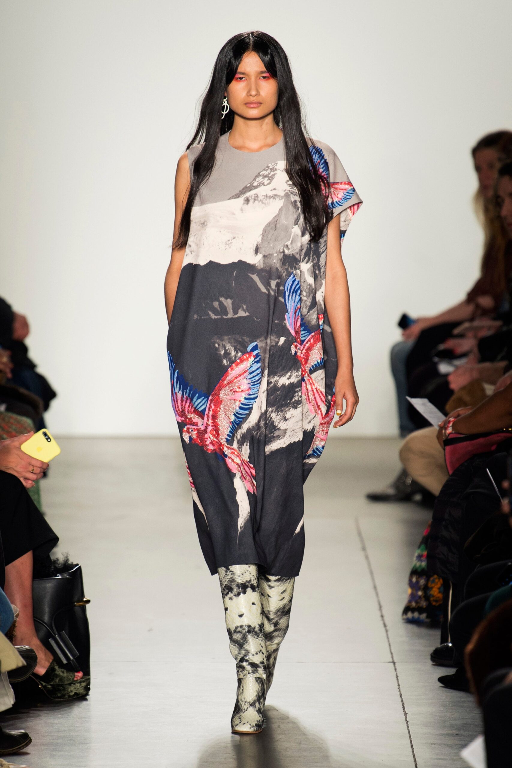 A relaxed gray dress with a high-neck and vibrant printed design featuring birds.