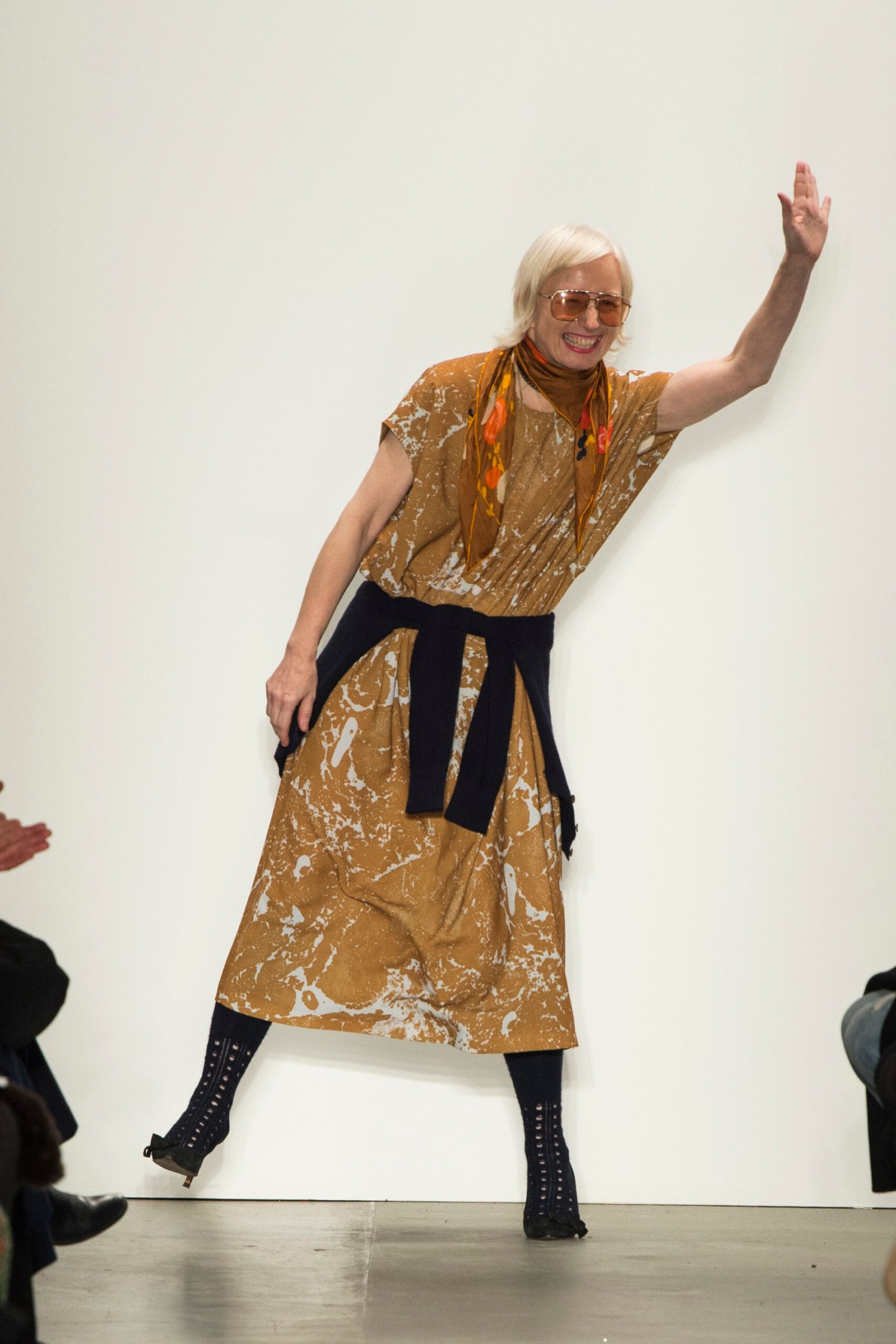 A relaxed brown cotton dress with short sleeves and a printed design.