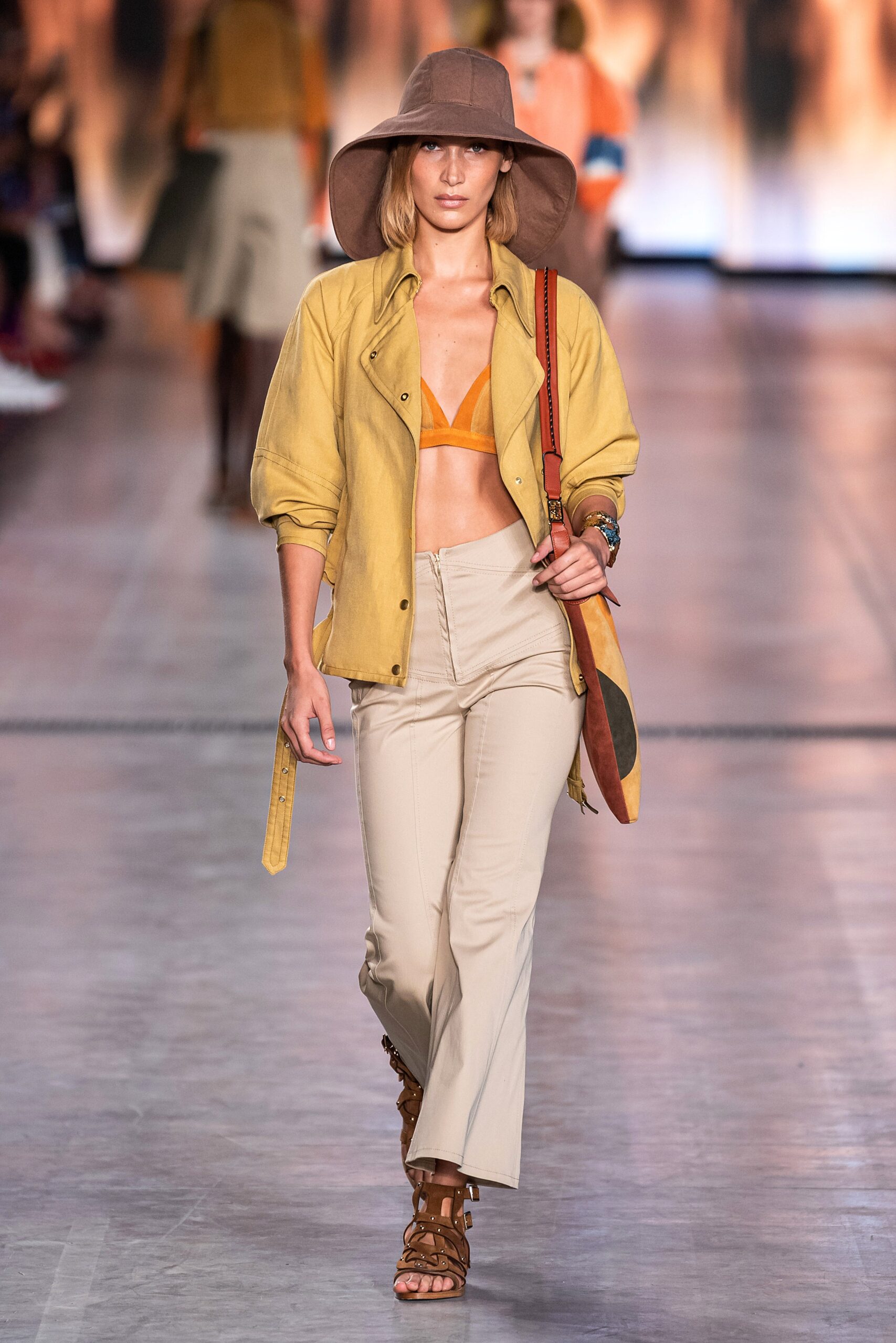 yellow shirt orange bikini beige pants