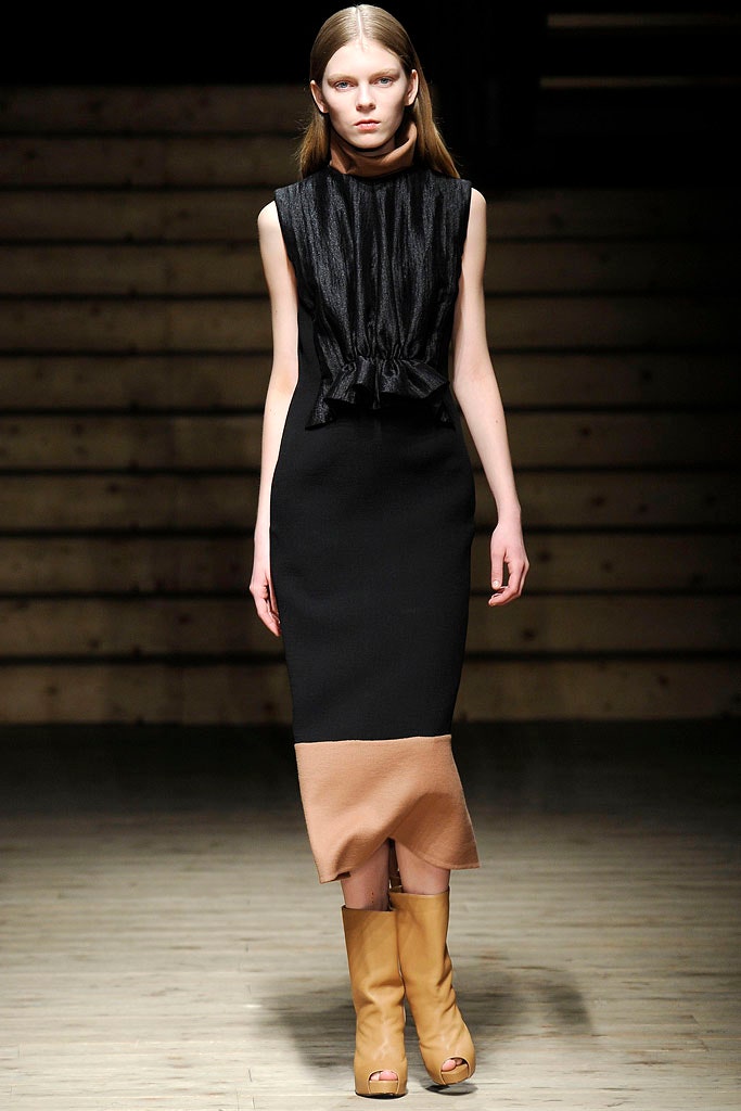 black and beige color-blocked midi dress with tan boots