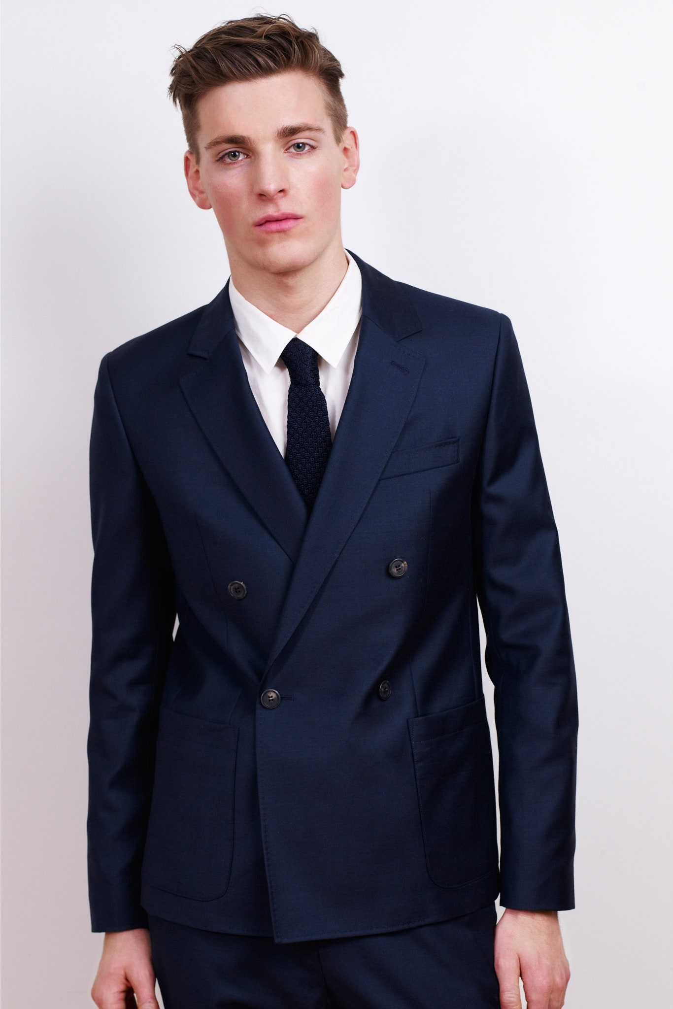 blue tailored suit with white shirt