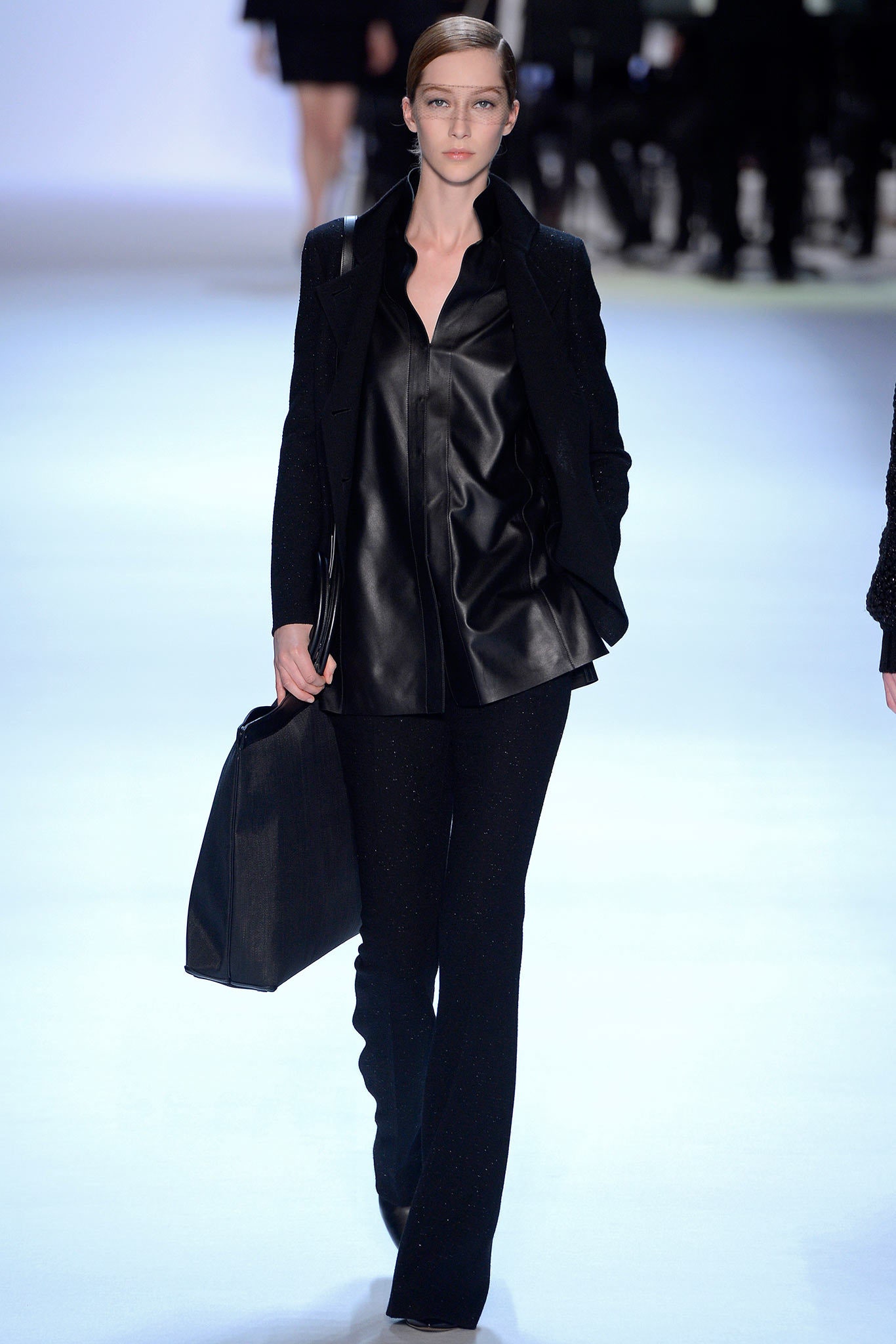 black leather blouse with fitted pants