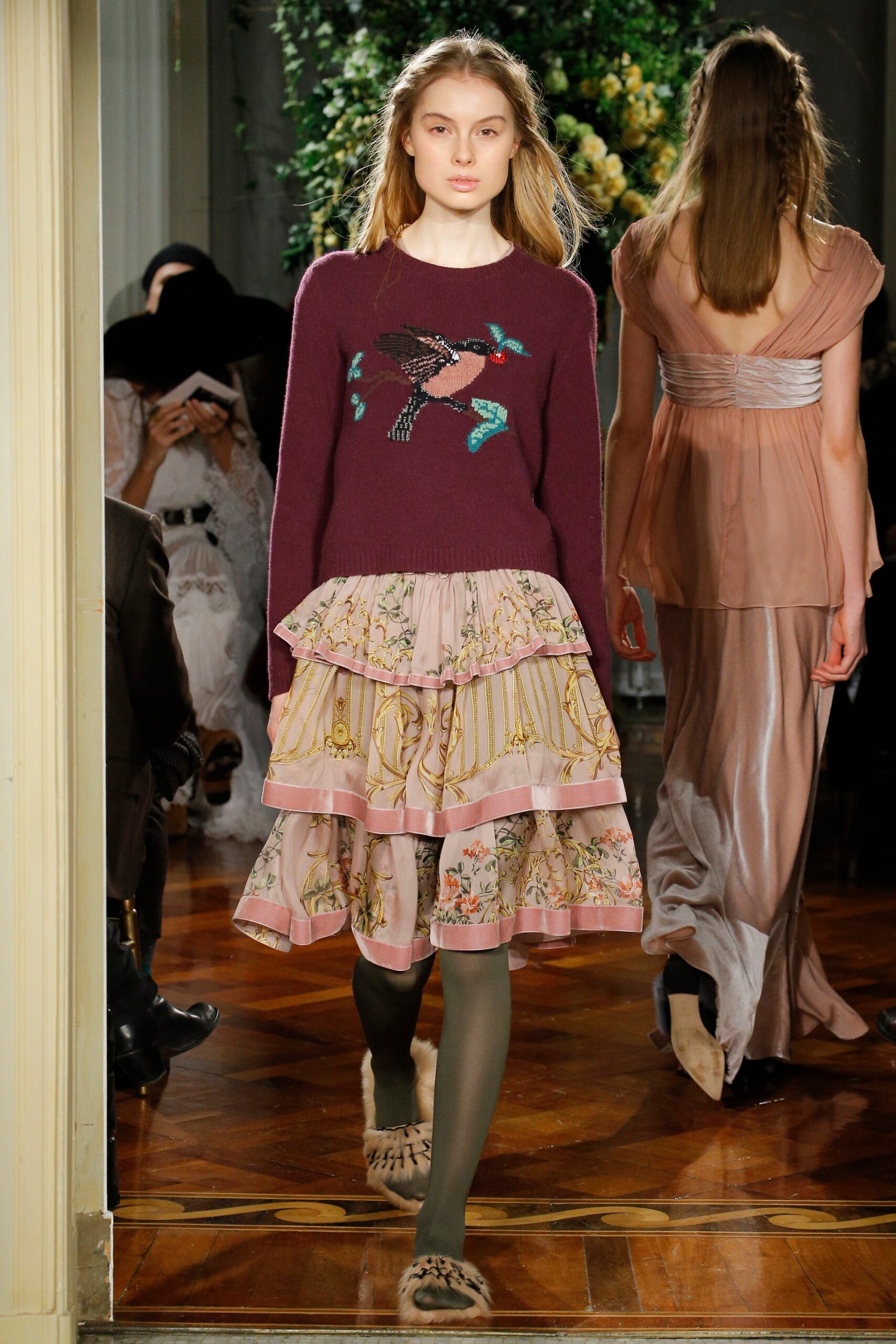 purple wool embroidered sweater and pink floral skirt