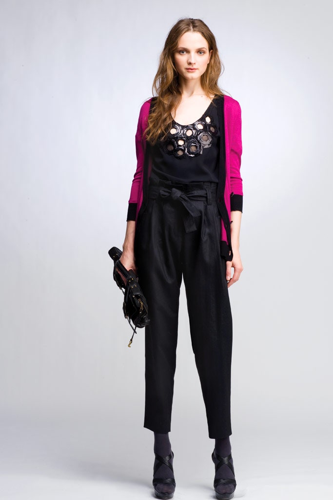 pink cardigan black top and pants