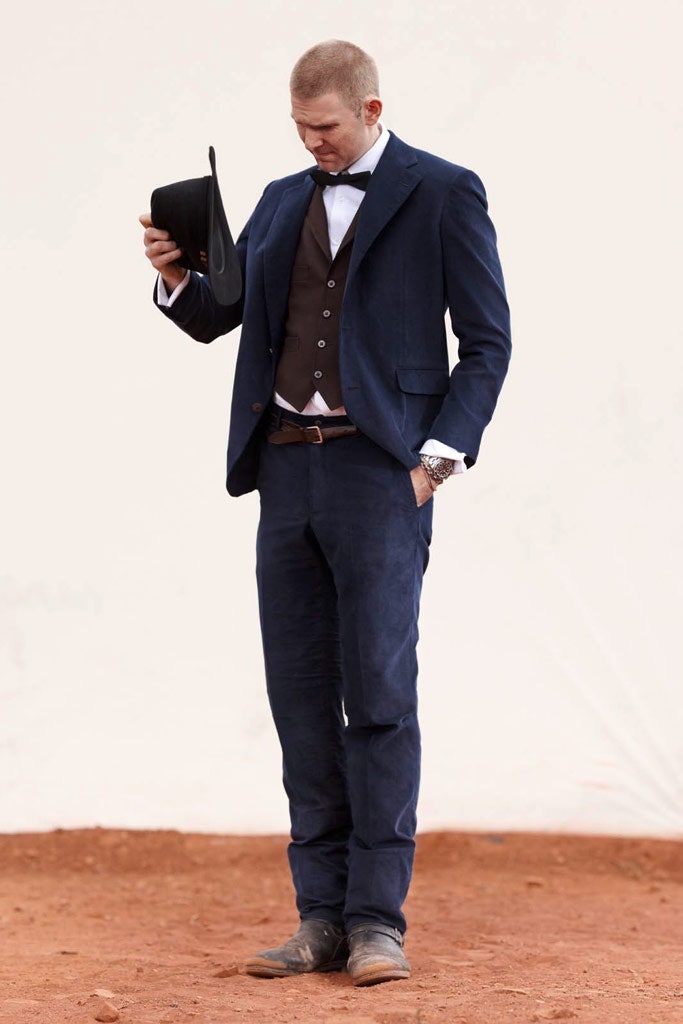 blue tailored suit with brown vest