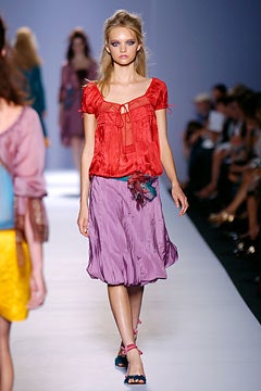 red silk fitted top and purple skirt