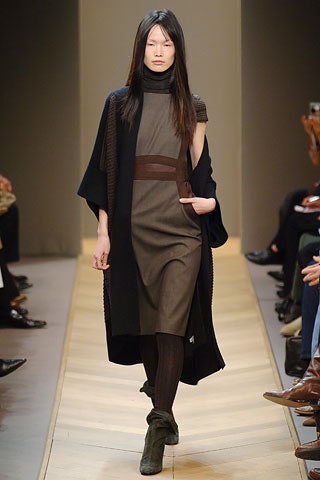 brown fitted midi dress with black cape