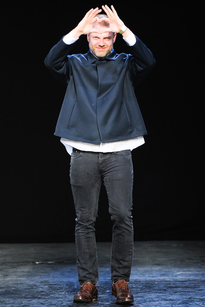 black jacket white shirt gray pants