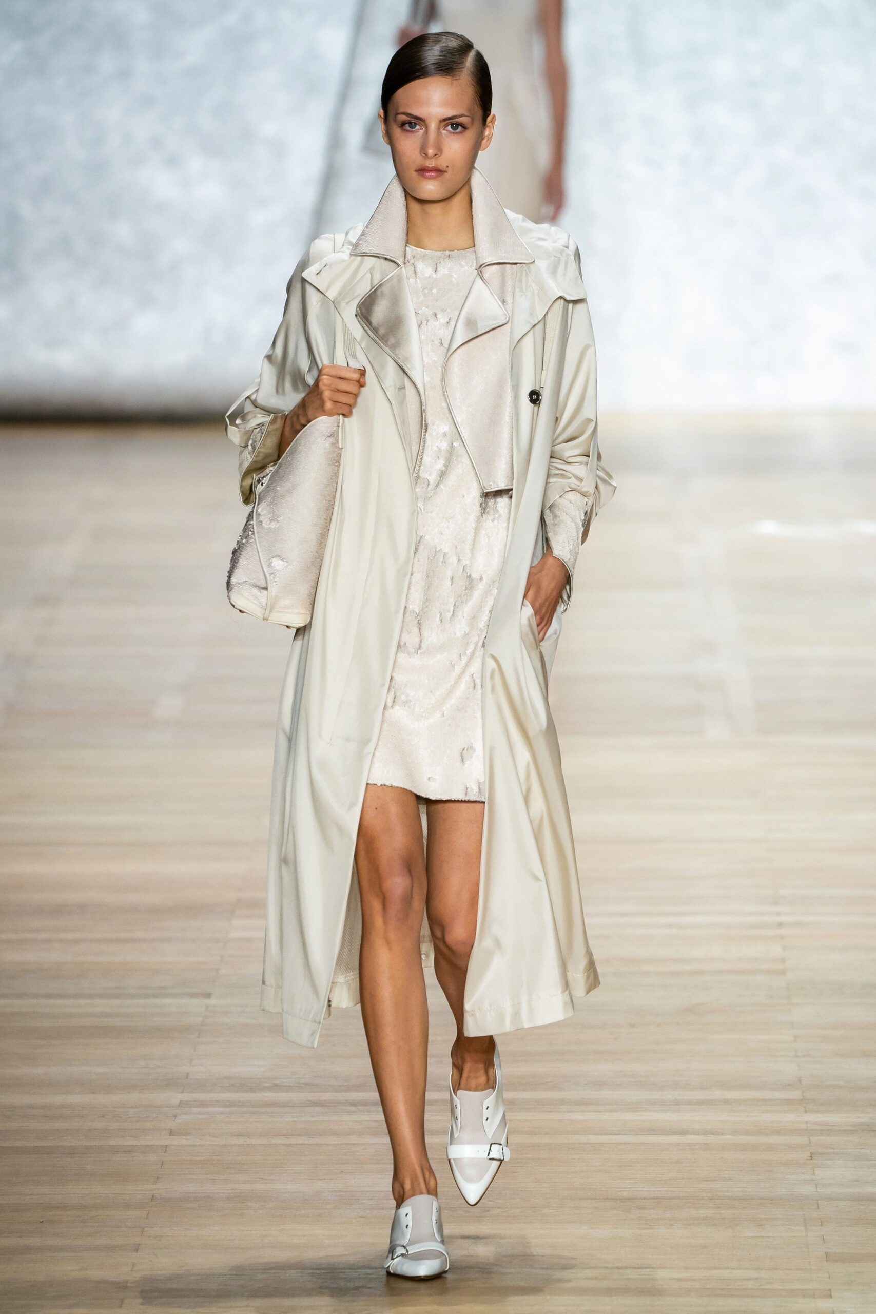 beige trench coat and white dress