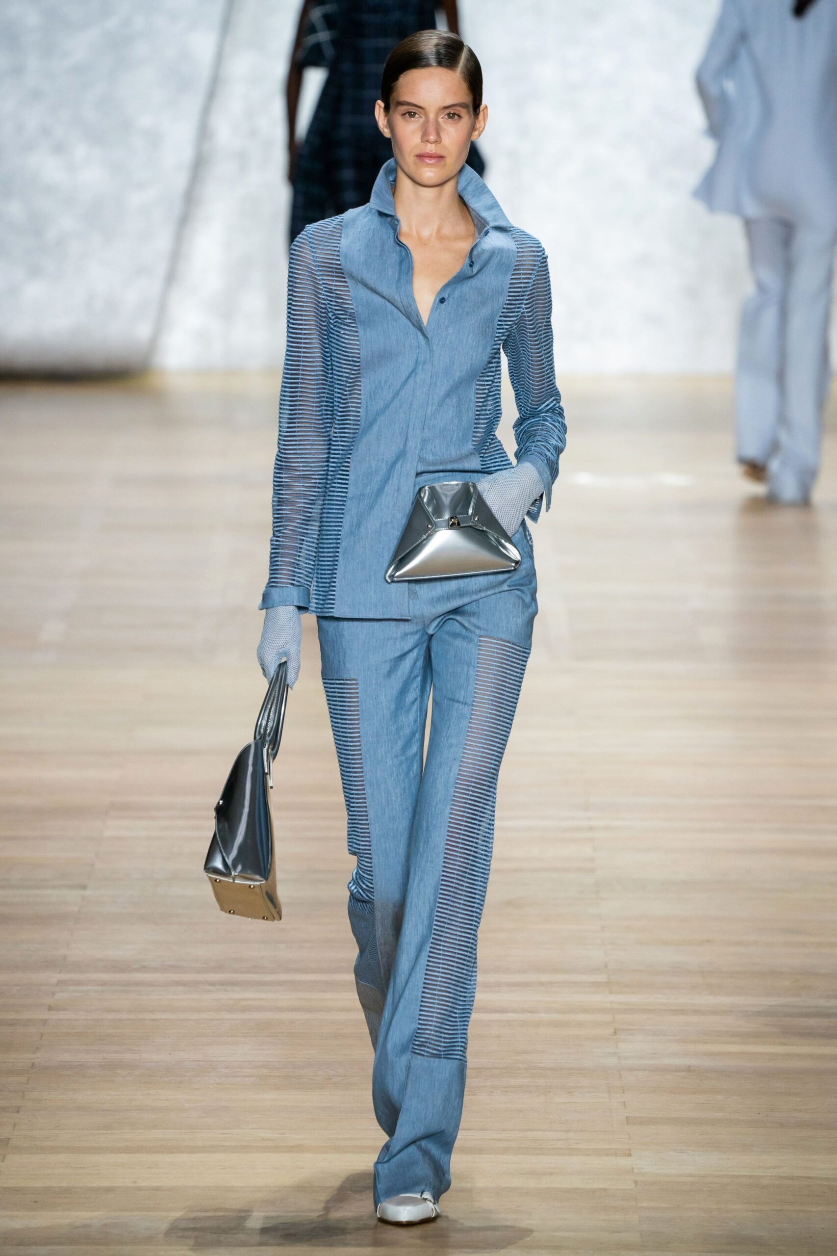 blue fitted suit with silver bag