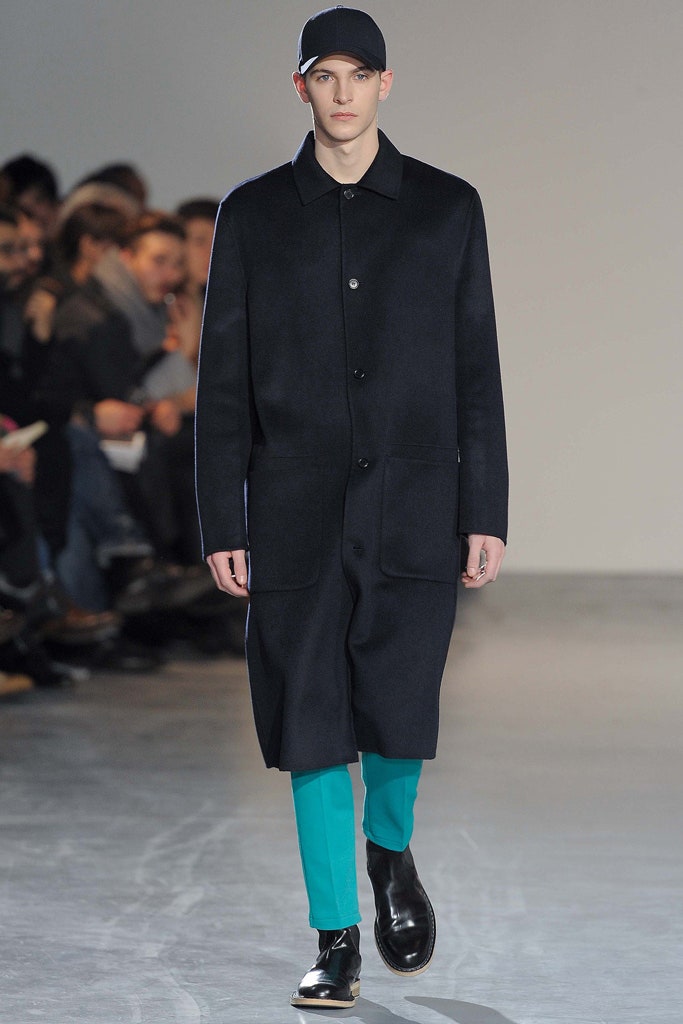 black wool coat with teal pants