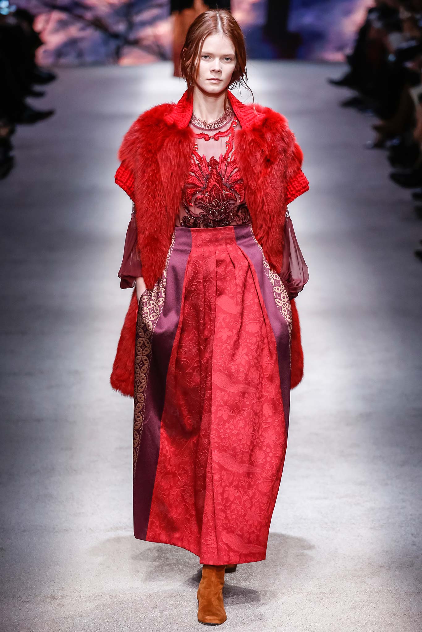 red faux-fur coat with embroidered blouse