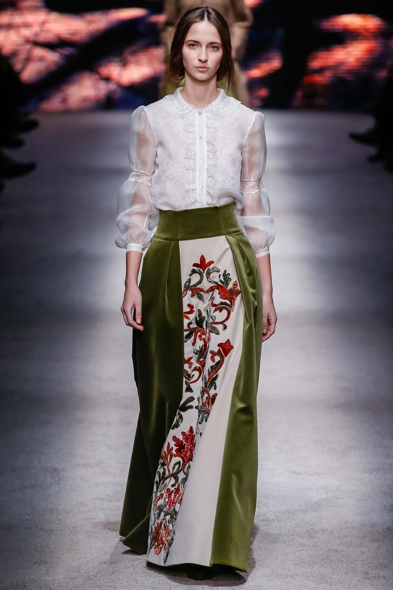 white silk blouse and green skirt