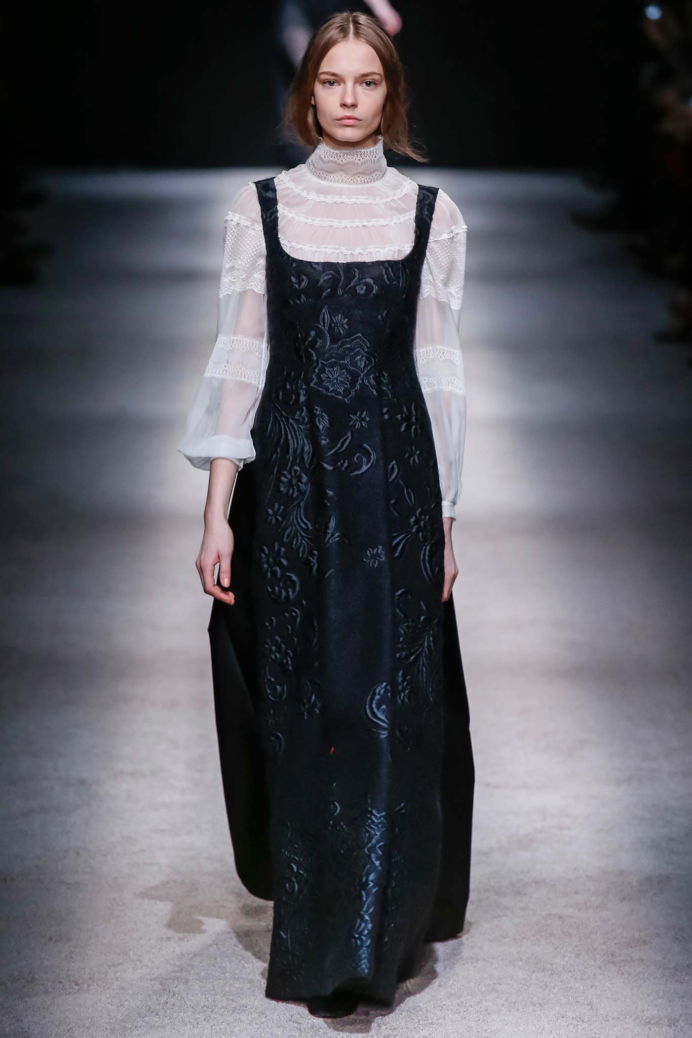 black embroidered midi dress and white ruffled blouse