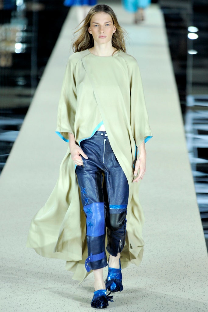 beige silk cape and blue denim pants