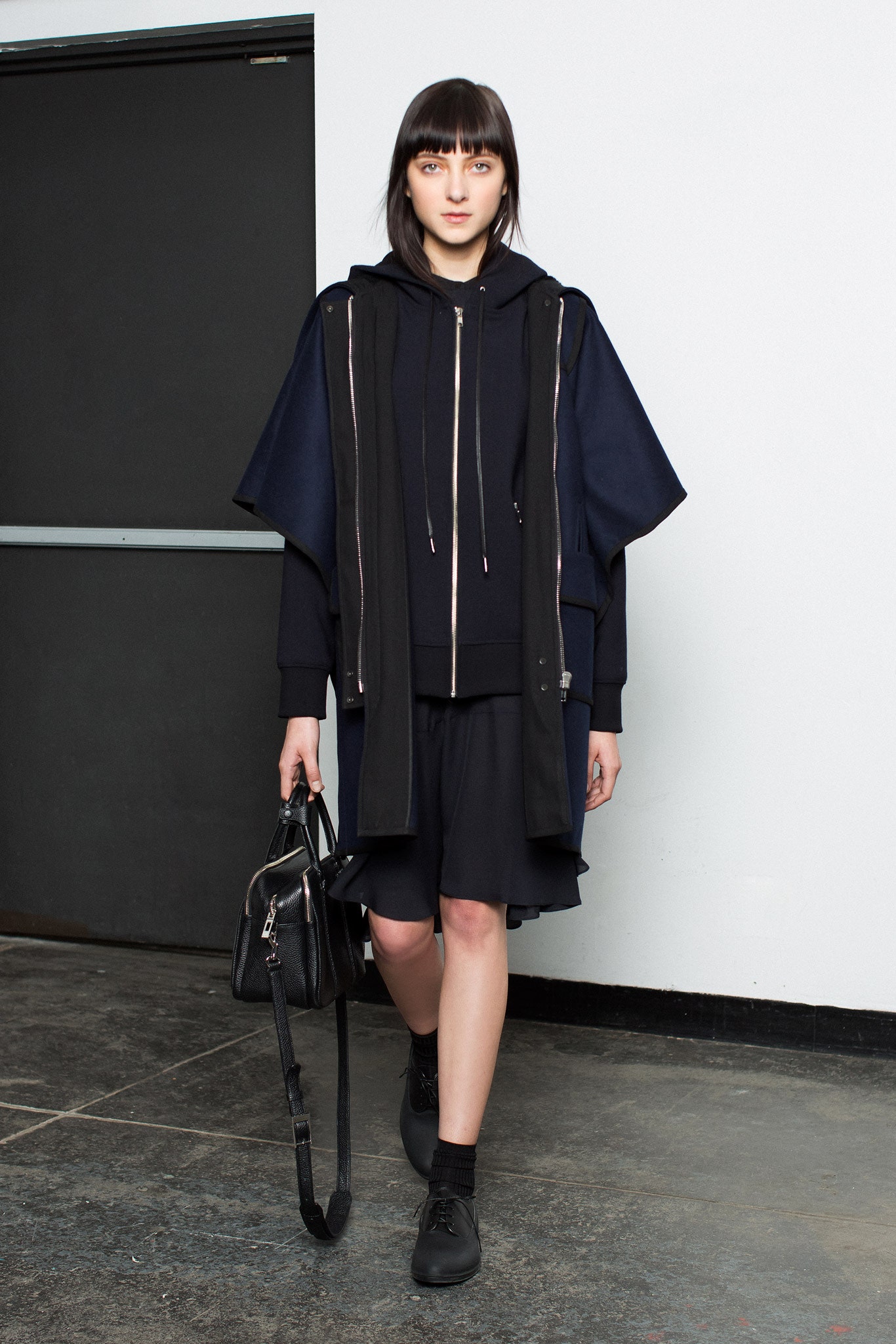 black hoodie with navy cape