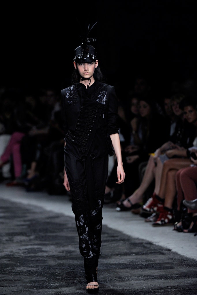 black fitted jumpsuit with embellished hat
