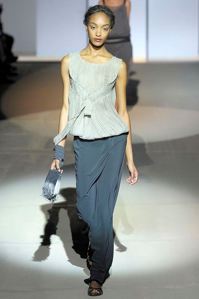 gray pleated top with blue skirt