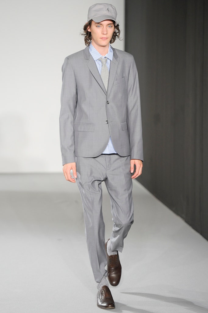 gray tailored suit with blue shirt