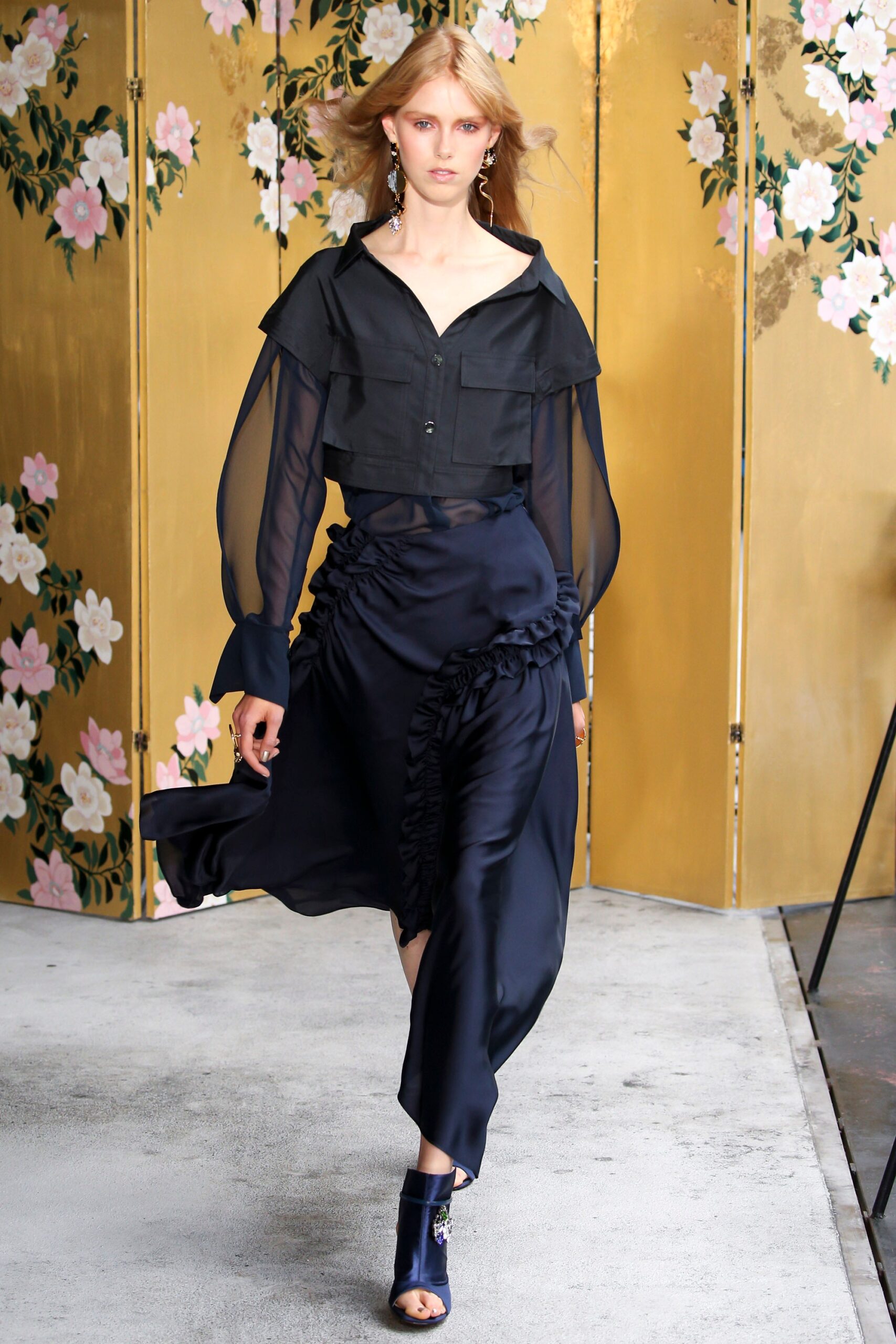 black silk blouse and navy skirt