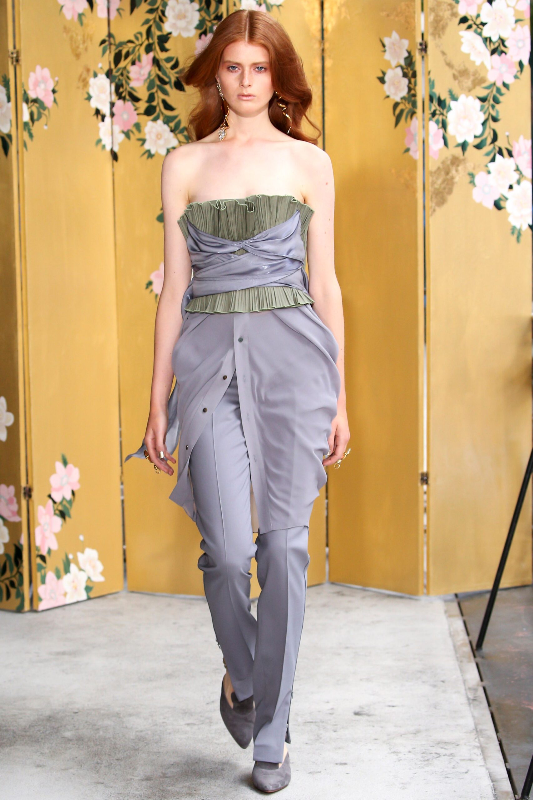 green pleated strapless top with gray pants