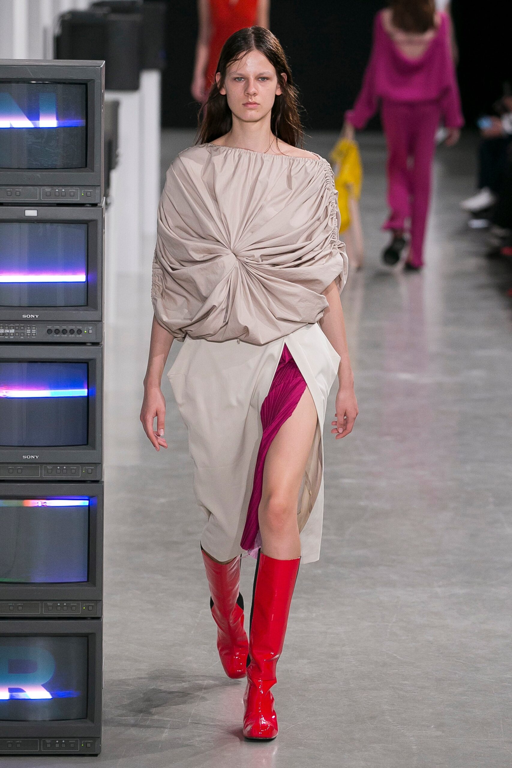 beige pink asymmetric dress with red boots