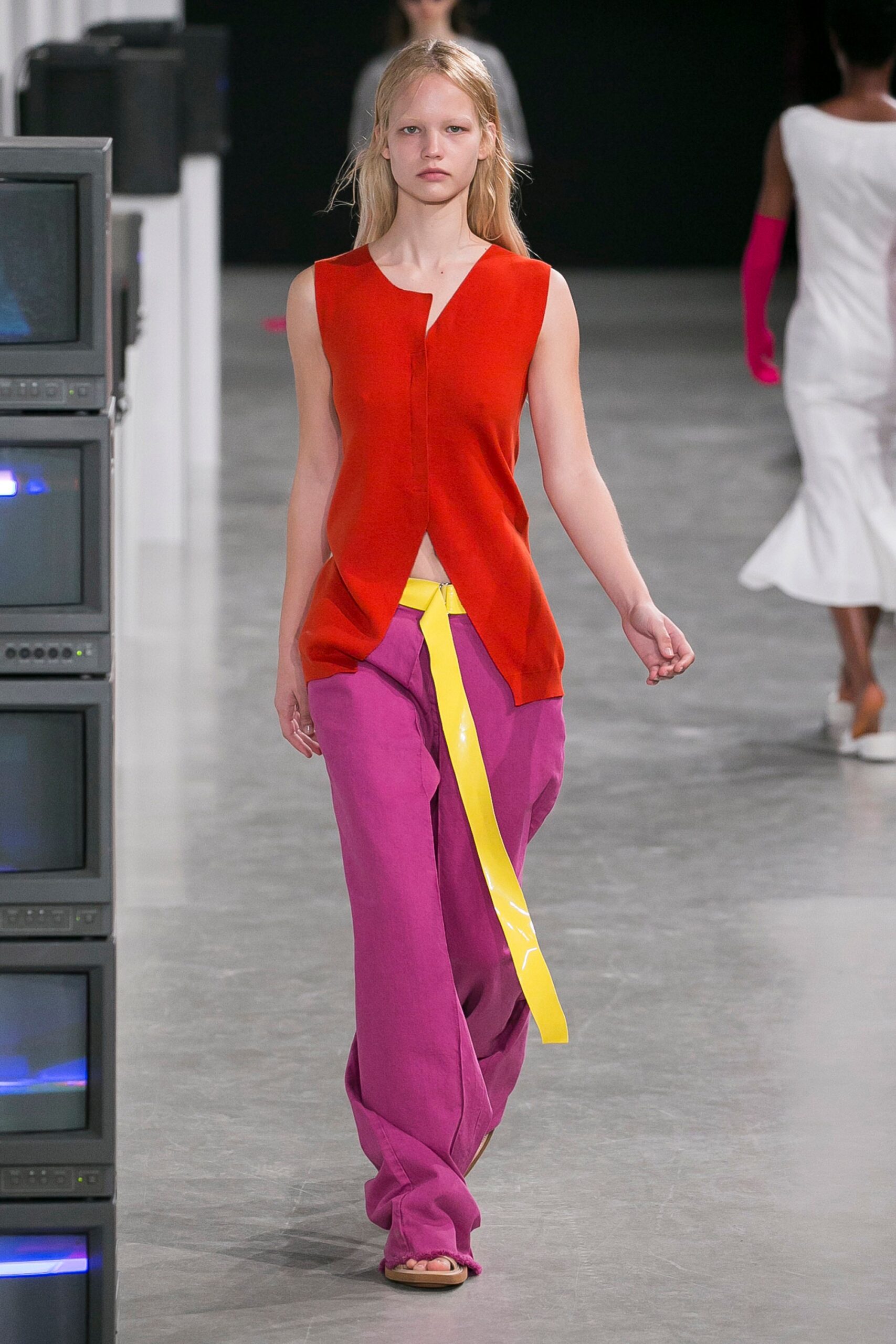 red asymmetric top with pink pants