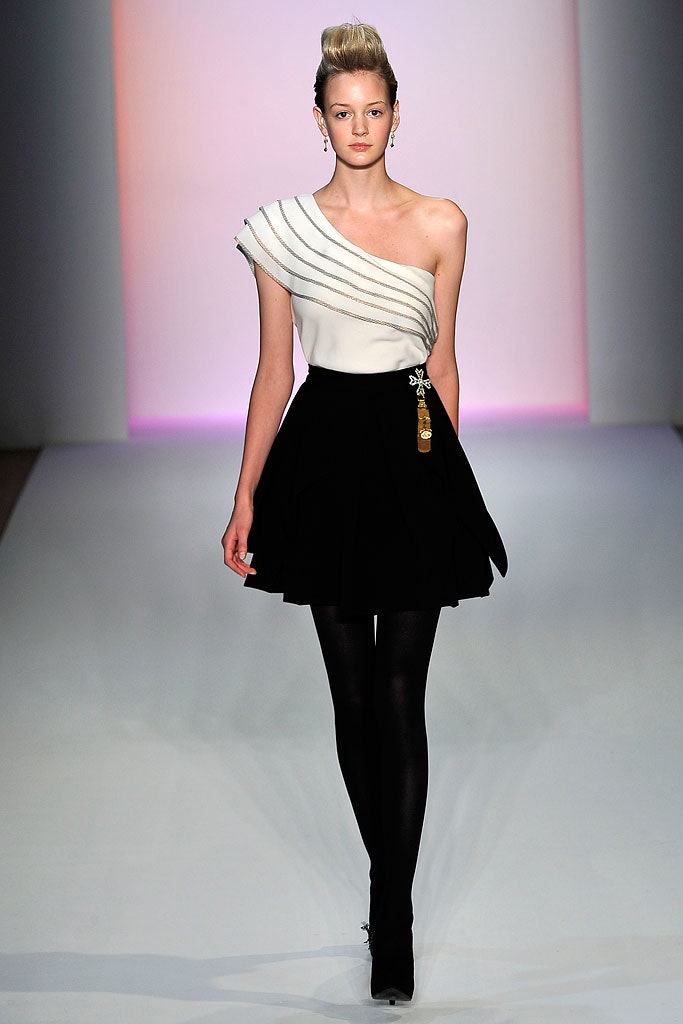 white asymmetric top and black flared skirt